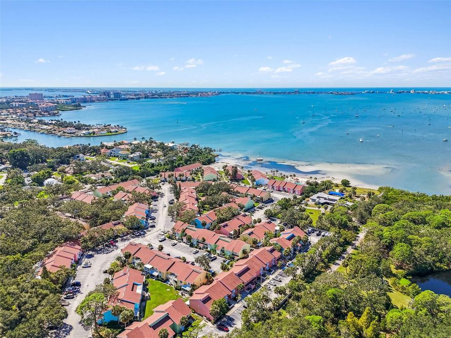 Ultra rare first/ground floor 3 bedroom located in the tropical paradise of Bermuda Bay Beach and Racquet Club.  Bermuda Bay boasts resort style living on the Boca Ceiga Bay Aquatic preserve which expands 23,700 acres. The home is adjacent to the 10 acre Clam Bayou Nature Preserve as its northern neighbor. Here You will find the perfect location to relax and enjoy sunbathing, swimming, kayaking, biking and walking trails, tennis, pickleball, birding, fishing and the beauty of the setting sun on Boca Ceiga Bay. Two heated pools, hot tub, Tennis, pickleball and shuffleboard courts, putting green, club house, a private beach and community boat ramp enhance your active lifestyle. Move in ready with new interior paint, the large living room leads out through the impact slider door to the large covered patio where you will enjoy Florida living. The kitchen includes updated wood cabinets, granite and upgraded appliances. There is an abundance of storage space, including large walk in closets and built in cabinetry.  Nearby attractions include: Suncoast beaches, many state, county and city parks, golf courses, museums, art galleries, performing art theaters, pro football, hockey and baseball, aquariums, gardens and close to shopping, banks, churches, restaurants, medical facilities, only twenty minutes from Tampa International Airport.