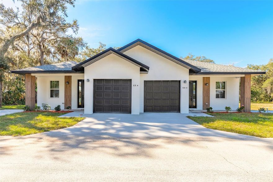 Brand-new turnkey duplex offering both units in a desirable New Smyrna Beach location, ideal for investors or property management portfolios. Each unit features a spacious 3-bedroom, 2-bath layout with modern design and upscale finishes throughout. The open floor plan showcases high ceilings, taller interior doors, and abundant natural light, with kitchens flowing seamlessly into the great room and opening to the outdoors through large triple sliding doors. Interior upgrades include quartz countertops and fully tiled, contemporary bathrooms for a clean, move-in-ready presentation. Additional features include concrete block construction, tankless water heaters, one-car garage per unit, dedicated extra parking pad, and separate electric meters. Excellent flexibility to rent both sides for strong income potential or occupy one unit while generating rental income from the other. Conveniently located near beaches, dining, shopping, and entertainment, this is a rare opportunity to own a modern income-producing property in one of the area’s most sought-after coastal markets. Some photos are virtually staged. All information is intended to be accurate, however not guaranteed.