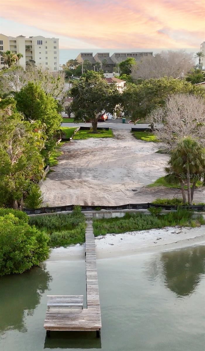 Featuring over 50 feet of waterfront, with your own Private Beach! North Redington Beach is one of Florida's true gems with a town park, tennis courts, pickleball courts, boutique shops and a wide variety of local dining options. From your new home, you will enjoy your own waterfront intercoastal views, with your very own Private Beach! You will enjoy sunrise views from your yard and sunset views at one of the best public beaches in the state of Florida, which happens to be a short walk from your own piece of paradise! You will be tucked away in a peaceful neighborhood with all conveniences within a couple mile radius of your new home. Sellers own two properties next to each other and are willing to sell them together at a discount. This is a rare opportunity to design your dream home on two lots. For the first time since it was custom built, these properties flooded during Hurricane Helene. This property has been professionally demolished and ready for whatever your heart desires. The potential and possibilities of this sanctuary are endless. To truly appreciate this rare opportunity, you must see this property in person. Pictures do not convey the beauty.