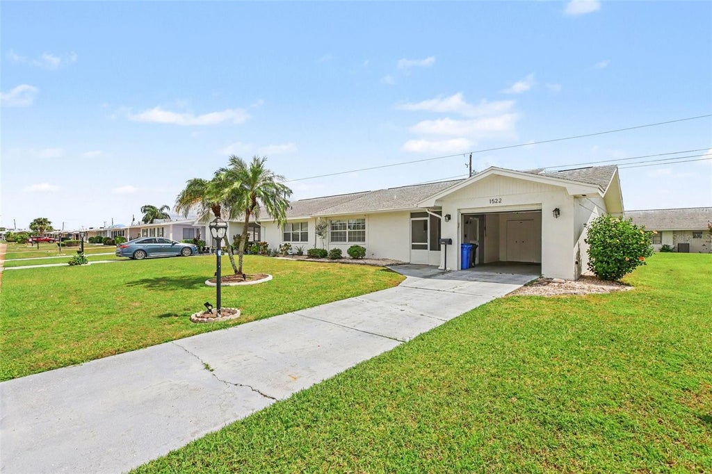 Photo of 1522 Belle Glade Avenue, Sun City Center, FL 33573 (MLS # TB8549205)