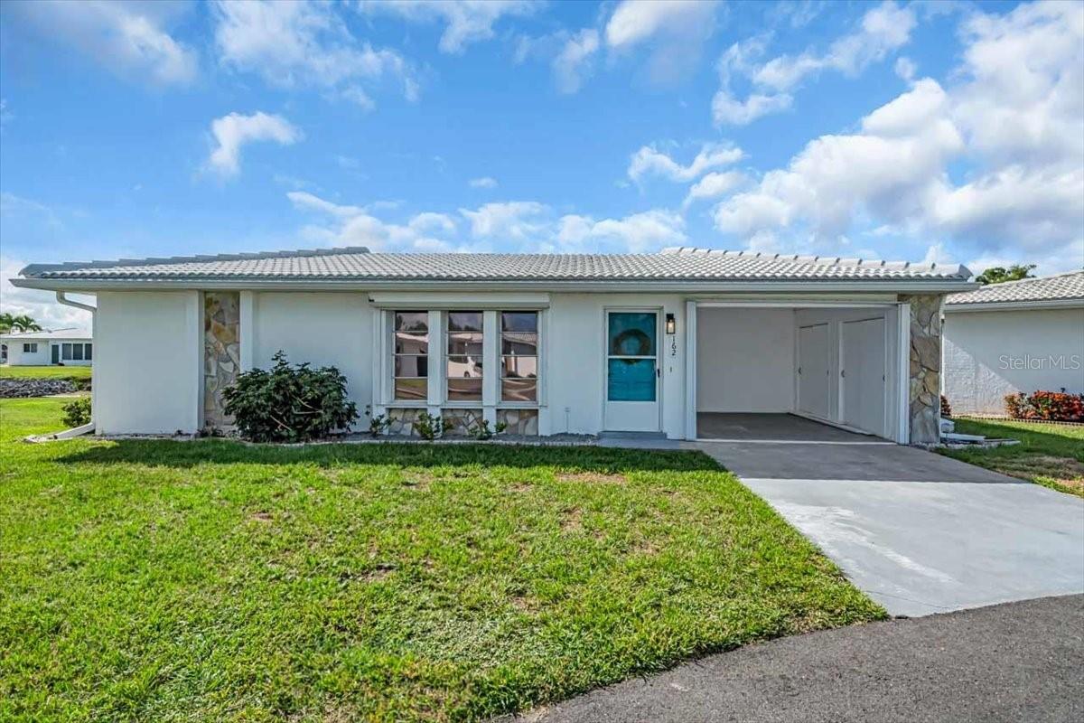 Welcome to the maintenance-free living in the coveted Circle Woods community. This standalone villa offers the ideal blend of privacy and convenient coastal lifestyle—without the noise or upkeep of connected units. Spacious split-plan layout featuring 2 bedrooms and 2 full bathrooms. Open bright living area at the heart of the home, flowing easily into an enclosed lanai or Florida room. Interior laundry room for maximum convenience. Detached structure: no shared walls for enhanced privacy and tranquility. Covered carport, ideal for morning coffee or relaxing with a view (often converted to a cozy outdoor retreat). Luxury vinyl plank flooring throughout main living and bedrooms spaces for easy maintenance. Enclosed lanai with the most beautifull view of the pond. Community Features & Lifestyle: clubhouse, two heated pools, fitness center, spa/sauna, game room, library. Active social calendar: Pub nights with live music, bingo, dominoes, line dancing, water aerobics, yoga, pickleball, shuffleboard, bocce, horseshoes, and more. Prime location: just minutes from Manasota Key and Venice beaches, downtown Venice, local seafood restaurants, and shopping. Come and take a look at this beautiful home and make it yours! Offered turnkey furnished and move in ready for additional fee!!! Minimum two-year ownership before leasing allowed.
