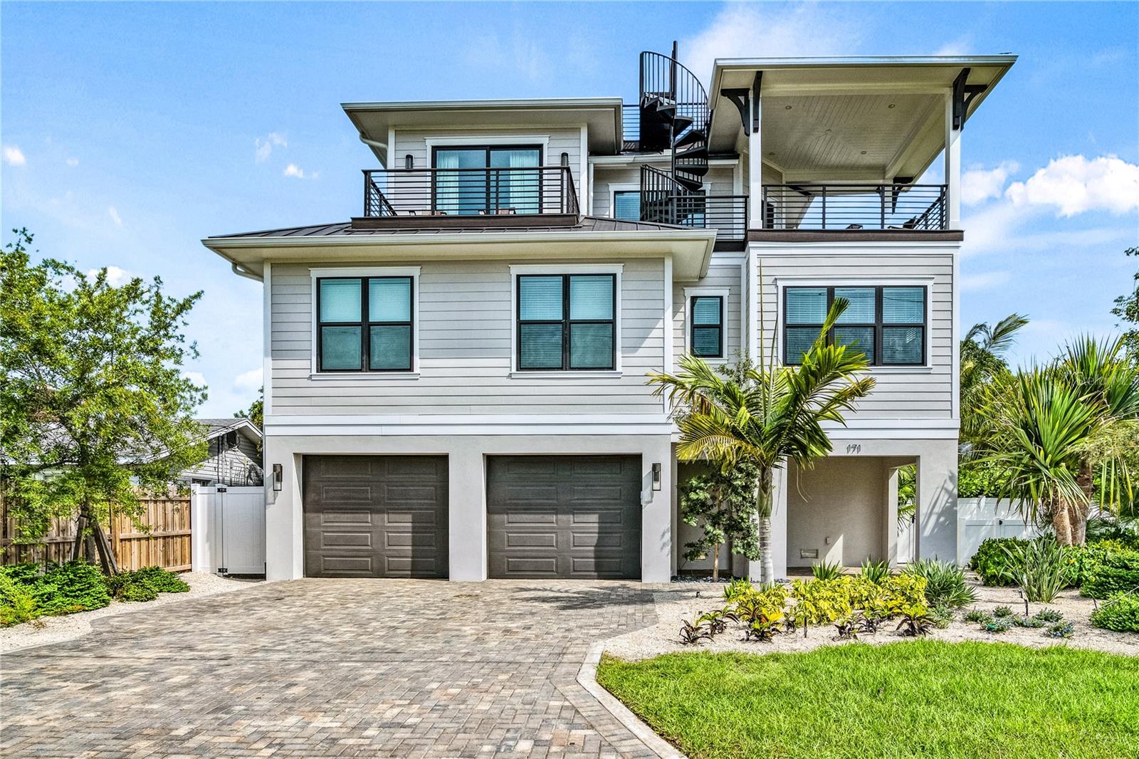 Lido Key luxury retreat with 9 bedrooms, 11 bathrooms a heated pool, spa & slide. Walk to Lido Beach or bike to St. Armand's Circle. This impressive home offers 9 master bedrooms, each meticulously designed for maximum space, and 9 full baths plus 2 half baths, allowing you to spread out. The home is sold turnkey furnished with luxurious sleeping arrangements of 8 King beds and 2 Twin bunk beds. Multiple balconies and patios further enhance your connection to the tropical surroundings. A modern, open-concept kitchen with top-of-the-line Wolf/Subzero appliances is the epicenter of this home. Comfortable furnishings allow for group gatherings both inside and outside on the pool deck.
Situated on a corner lot located on the beautiful Lido Key, where sophistication and coastal opulence seamlessly combine in this residence.
Lido Key Beach is a short 0.3-mile stroll from your door, where you can enjoy pristine sparkling sands, ensuring you make the most of the beautiful coastal setting.
The stunning rooftop deck provides panoramic views of the picturesque surroundings, offering a serene space to unwind. Whether you're savoring the warm island breeze or soaking up the sun, this space is the perfect place to unwind.
This exquisite property offers a wealth of luxury features, creating the ideal escape for those who demand both relaxation and elegance. New owners will be able to inherit future vacation rental reservations, maintain the same property management company and have an instant income producing property.