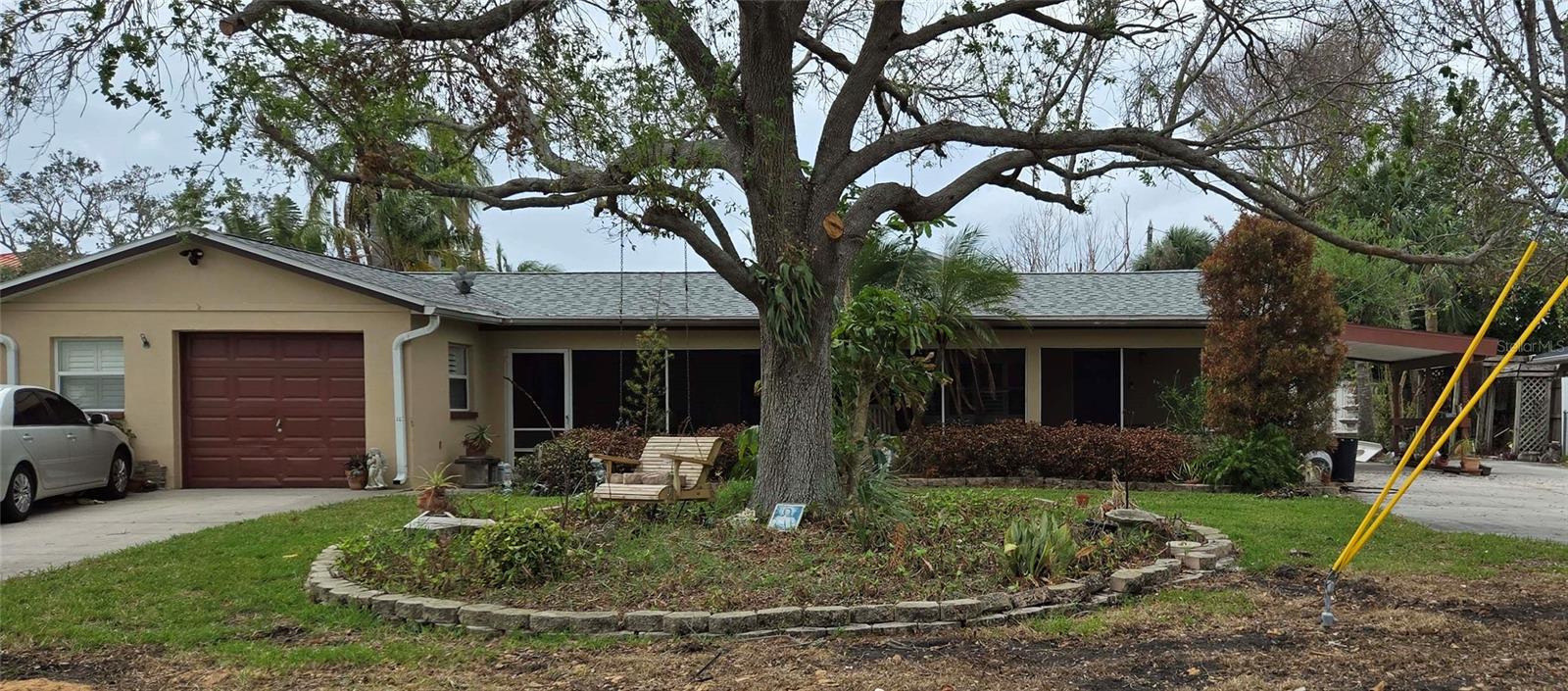Perfect investment opportunity, two homes in one, 3 bedrooms 2 baths in each home, two laundry rooms, two private driveways, plus large bonus room and office space. Can also be easily divide for two to three income properties or perfect for a family on one side and parents on the other, so many possibilities! Quiet neighborhood with a great walkability score. Private Pool and Private Swim Spa. Four screened porches for the ultimate Florida home, great for entertaining! Flooded by Helene being sold as is and needs remediation. Zoned RM-10 Residential Multi Family. Ready for your dream design!