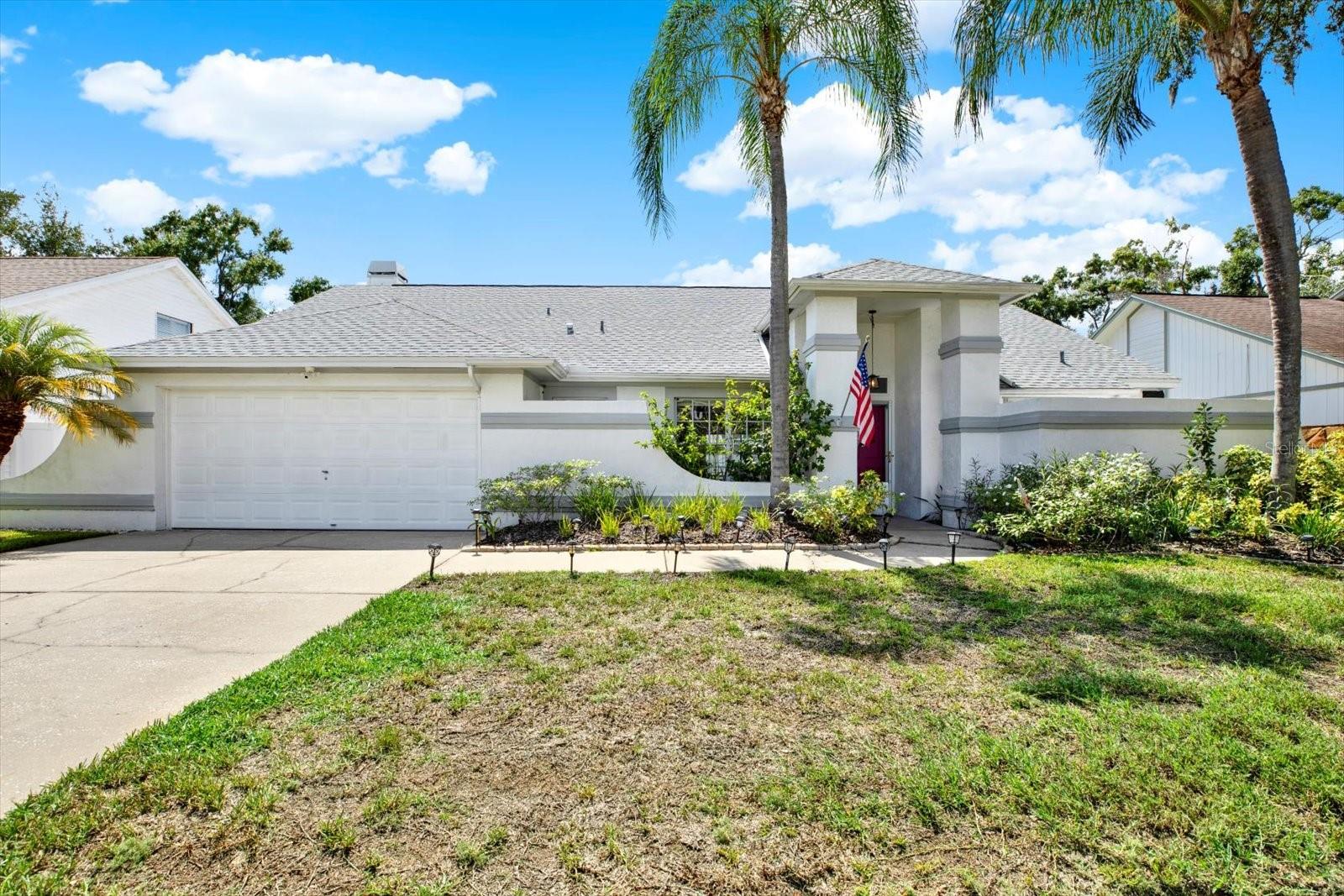 Welcome to Hampton Lakes! This spacious pool home offers over 2,200 sq. ft. of living space with 4 bedrooms and a versatile layout designed for both comfort and entertaining. Nestled on a private lot with a newer roof and new vinyl fencing, the home blends privacy with convenience-just minutes from Dale Mabry, shopping, dining, and quick access to downtown and the stadium.
Step inside to find soaring ceilings, a wood-burning fireplace, and a large family room that flows naturally into the screened pool area—perfect for gatherings or quiet evenings at home. The oversized primary suite includes direct pool access, while the additional bedrooms provide flexibility for guests, a home office, or a fitness room. A bright kitchen features new appliances, and the formal dining space overlooks the front yard’s mature trees and lush landscaping.Outdoors, enjoy the sparkling enclosed pool and generous patio space ideal for entertaining. Surrounded by tree-lined streets and peaceful fountain ponds, Hampton Lakes offers the charm of a tucked-away neighborhood while keeping you close to everything Carrollwood provides. Don’t miss the chance to call this home yours—schedule your showing today!