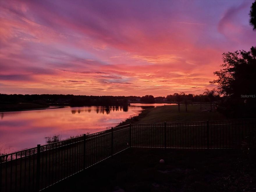 Lakefront living in Hudson, FL! Welcome to this beautifully maintained 4-bedroom, 2-bathroom, 2-car garage home located in the highly desirable Lakeside Woodland community. This single-story home features an open floor plan with a spacious layout perfect for entertaining, including a large kitchen with an oversized island, abundant cabinet space, and seamless flow into the living and dining areas. Enjoy stunning water views, breathtaking sunsets, and front-row seats to 4th of July fireworks right from your private paver patio. The primary suite offers a relaxing retreat, while additional highlights include a fully fenced backyard, brand new A/C, and plenty of natural light throughout. Residents of Lakeside Woodland enjoy resort-style amenities including a community pool, park, and clubhouse, all conveniently located near restaurants, shopping, hospitals, and just minutes from area beaches and the Gulf Coast. Move-in ready and offering the perfect blend of comfort, convenience, and Florida waterfront lifestyle!