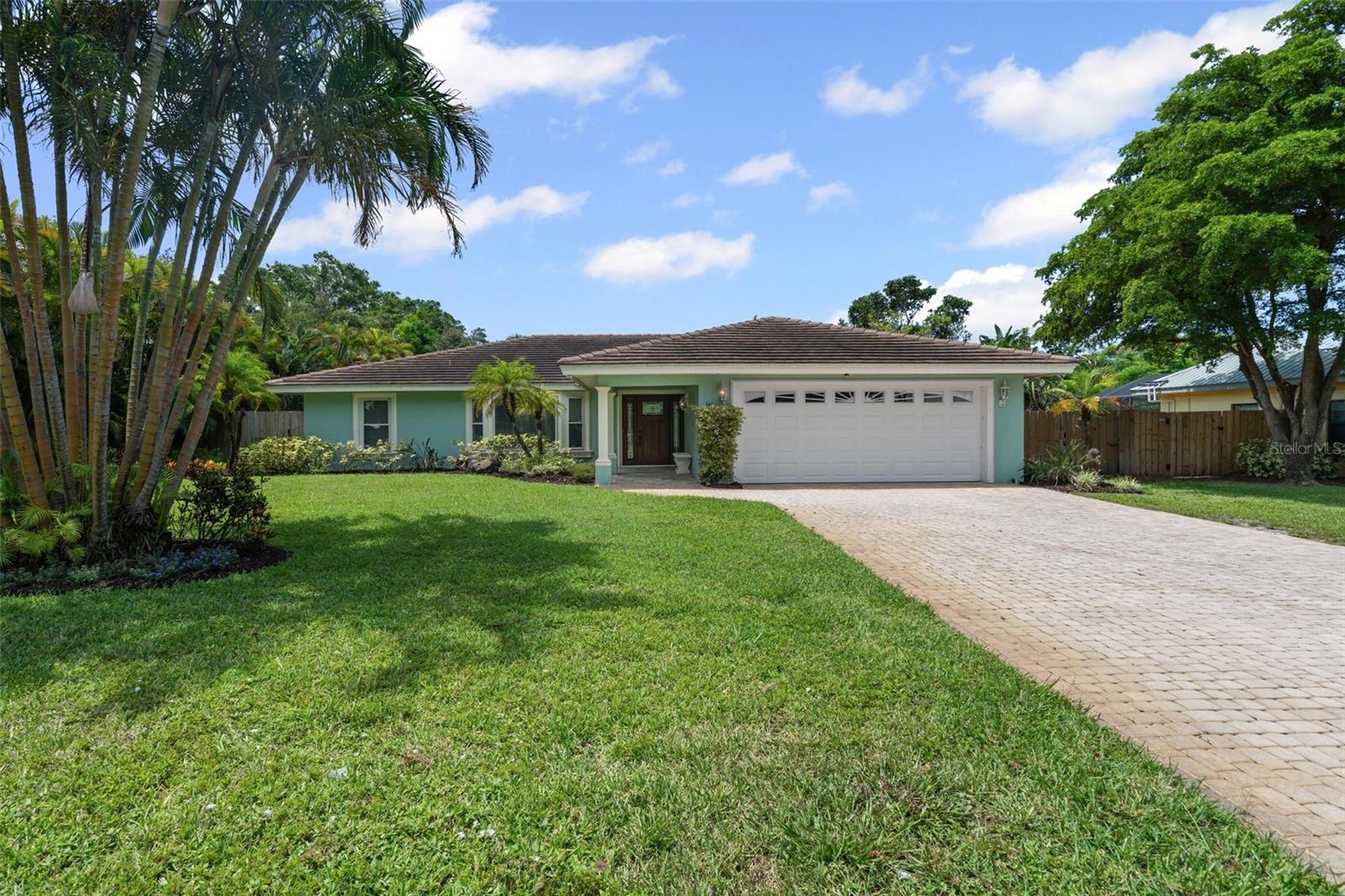 West of the Trail and just steps from Sarasota Bay, this tropical retreat is your chance to own a true slice of Florida paradise.
Step into your own private oasis featuring a resort-style pool, tiki hut, and outdoor kitchen, perfect for entertaining or soaking up the sunshine year-round. This 3-bedroom, 2-bath block home offers a functional layout with a 2-car garage and dedicated laundry room. Updates include a 2019 tile roof, impact sliders and updated windows, 2023 tankless water heater, 500G propane tank fueling the spa, outdoor grill and generator hookup. Updated kitchen 2024. New A/C and ductwork, outdoor patio kitchen, ice machine and submersible well pump for irrigation. New ADT smart pad security system with indoor and outdoor cameras, plus Ring doorbell and garage door control via ADT app. Situated on just under half an acre, the fenced backyard is surrounded by lush tropical landscaping for ultimate privacy and serenity.
Located outside the flood zone with no CDD fees and no HOA, this home also allows for nightly rentals, making it ideal as a primary residence, seasonal escape, or income-producing investment.
Tucked away in the charming community of Whitfield Estates and Ballentine Manor, you’re perfectly positioned near Sarasota Airport, IMG Academy, Downtown Sarasota, Downtown Bradenton, St. Armands Circle, Lido Key, and Anna Maria Island. Boaters will love the proximity to SaraBay Marina with boat slips and dry storage, and for just $30/year, residents can enjoy access to a culinary membership at SaraBay Country Club.
This is your blank canvas in one of the area’s most sought after neighborhoods. Don’t miss this rare opportunity to create your dream Florida lifestyle.