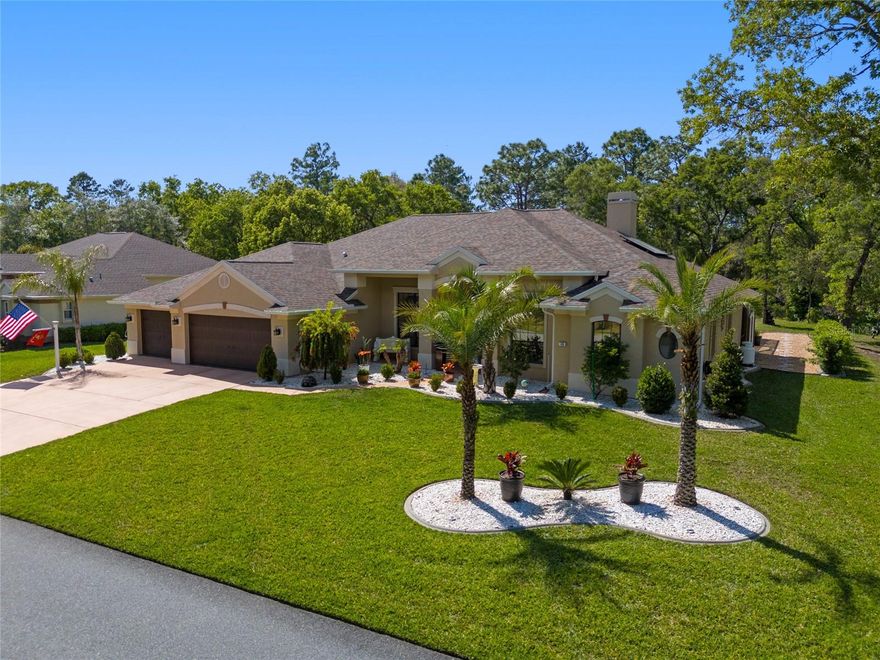 Welcome home to your Better-than-new concrete block pool home which offers exceptional craftsmanship, energy efficiency, and privacy in a highly convenient Nature Coast location. All the upgrades! Featuring a 2021 roof and leased solar panels at $214/month (transferable with approval), the home enjoys an average electric bill of approximately $30 a month, and newly installed AO 50 gallon water heater making it both luxurious and cost-efficient. The thoughtfully designed floor plan includes 3 bedrooms, 2.5 bathrooms, a dedicated office, and a 3-car garage. The third garage bay is currently configured as a workshop and all garage doors have been upgraded to hurricane-rated R-19 doors. Additional features include pull-down attic access, radiant barrier insulation, and enhanced insulation throughout the home, garage, and lanai, along with custom built-in garage storage. Freshly painted inside and out, the home also features a sealed and stained driveway and is perfectly positioned backing up to a greenbelt, offering exceptional privacy and peaceful views. Interior upgrades include a new HVAC A-coil ($5,000), whole-home ionizer, double-pane windows, front-facing window tint, custom plantation shutters, rear 3” faux wood blinds, and custom electric sunshades. The enclosed pool and lanai are ideal for year-round enjoyment, enhanced by a new variable-speed pool pump and heater. The professionally landscaped, eco-friendly yard is designed for minimal maintenance and showcases ProVista St. Augustine sod, palms, decorative rock, pavers, and curbing, delivering outstanding native curb appeal. A welcoming front porch provides the perfect setting to enjoy morning sunrises, while the enclosed pool area offers stunning sunset views. Inside, the home impresses with 12-foot ceilings, rounded corners, and refined custom details throughout. The custom kitchen features newer appliances, a 2018 refrigerator, pull-out drawers, and a walk-in pantry, blending style with functionality. The primary suite serves as a private retreat with dual walk-in closets, a spacious walk-in shower, and a soaking tub. Ideally located near Inverness, Homosassa, Crystal River, and Spring Hill, with shopping just minutes away and only one mile from the intersection of Highway 19 and Highway 98, this home offers both convenience and tranquility.  A rare opportunity to own a turnkey, energy-efficient pool home with greenbelt privacy and premium upgrades in one of Florida’s most desirable coastal regions.