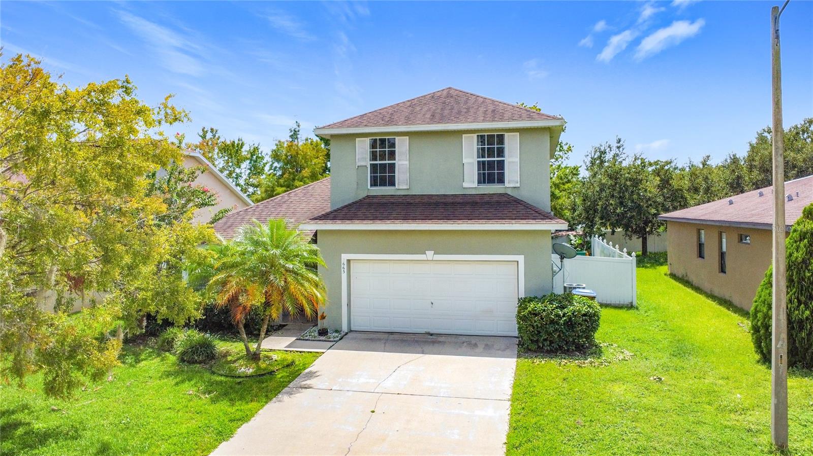 Welcome to your dream home in Kissimmee! This pristine two-story, 4-bedroom, 2.5-bathroom single-family residence spans approximately 2,399 sq ft and was thoughtfully built in 2008. Lovingly maintained, this home features a roof replaced in 2019, and AC system updated in 2021, ensuring peace of mind. Step inside and be greeted by beautiful ceramic tile on the first floor, with a master bedroom conveniently located on the main level. The bright and inviting formal living room leads into a well-appointed kitchen with wood cabinets and stylish backsplash, where appliances under five years old offer both modern convenience and reliability. Functional spaces include a dedicated laundry room and a rear porch that overlooks a generously sized, fully fenced backyard—perfect for play, pets, or outdoor entertaining. Completing the home is a spacious 2-car garage, offering ample storage and parking. Located in a vibrant community, you’ll enjoy access to amenities such as a community pool, playground, and tennis courts. Commuting is a breeze with nearby major highways, and just minutes from Disney parks, as well as a variety of restaurants and schools. This home perfectly balances comfort, style, and location. Don’t miss your chance to make it yours!