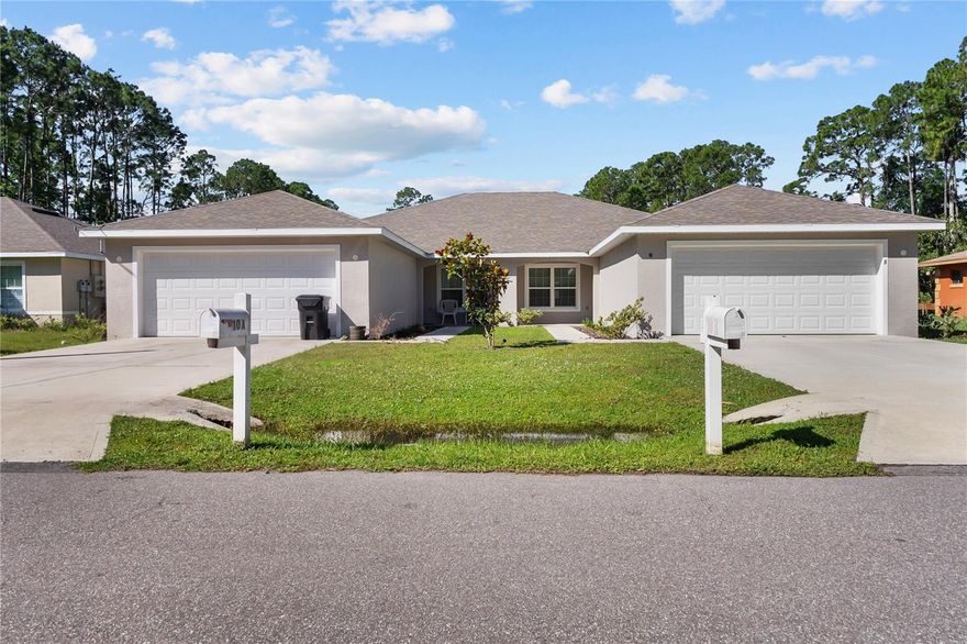 One or more photo(s) has been virtually staged. LARGE SPACIOUS DUPLEX WITH LONG-TERM TENANT – GREAT LOCATION | NO HOA
Excellent investment opportunity and minimal expenses. This generously sized duplex is located in a desirable Palm Coast location near schools, shopping, dining, major roadways, and just minutes from the beach.

Each unit features 4 bedrooms, 2 bathrooms, a 2-car garage, and an inside laundry room. Spacious living rooms with soaring vaulted ceilings, creating an open and airy feel. The open-concept kitchen includes a large pantry, beautiful cabinetry, granite countertops, and overlooks the living area. BOTH units have stainless steel appliances including refrigerator, range, microwave, dishwasher, clothes washer, and dryer are all included. Vertical blinds are also included throughout the property.  Fully tiled side A and B Duplex.
Washer and dryers included in both units.

Electric and water are separately metered, with utilities paid directly by tenants — helping keep owner expenses low.

INCOME INFORMATION:

Total Projected Gross Monthly Income: $3,770/month
Projected Annual Gross Income: $45,240

Unit A: Currently leased at $1,885/month
Lease expiration: August 31, 2026
Unit B: Recently vacated
Projected rent: $1,885/month

Approximate Annual Expenses:
• Lawn Care: $1,200
• Property Taxes: Approximately $8,000
• Insurance: Approximately $1,800
Approximate Net Annual Income: $34,308

***SPECIAL BUYER INCENTIVE: Professional Property Management INCLUDED for 1 full year through The Cavalieri Property Management.

Schedule your private showing today.