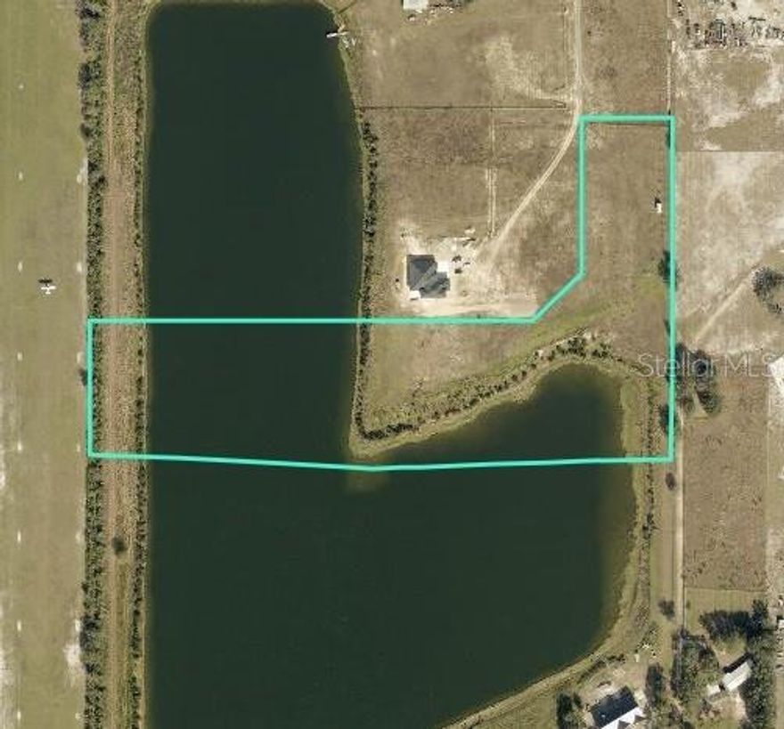 Welcome to an extraordinary opportunity at 4936 Wauchula Road in Myakka City, nestled within the exclusive 16-lot community of Lakeside Ranch. Spanning 11.53 acres, this is the largest lot currently available in the community, offering a rare blend of expansive acreage, premium waterfront, and exceptional privacy in a neighborhood where each homesite encompasses a minimum of five acres.The property is fully fenced and includes a large shed for storage, equipment, or future project needs. Irrigation and power are already in place, and numerous established fruit trees enhance both the character and usability of the land as you design and build your custom residence.Set along an estimated 30-acre boatable lake, approximately 40 feet deep and even seaplane-friendly, this property offers a truly distinctive waterfront lifestyle. While a residence may be positioned anywhere on the parcel, the most prized homesite lies at the interior corner of the lake, offering two sides of water frontage totaling approximately 850 feet and a rear western exposure that captures breathtaking sunset views across the water. The association permits the construction of up to two private docks, ideal for boating, fishing, paddleboarding, kayaking, or simply enjoying tranquil days on the water.With ample space for horses and additional improvements such as barns, workshops, or guest quarters, the property lends itself beautifully to an equestrian estate or private family compound.Lakeside Ranch is known for its lakefront lots, estate-sized parcels, natural beauty, and peaceful setting, while still offering convenient access to nearby amenities. Interstate 75 is approximately 40 minutes away, providing easy north–south travel. Lakewood Ranch Main st. is approximately 35 minutes away for shopping, dining, medical facilities, and entertainment. The Mall at University Town Center (UTC) is approximately 40 minutes away. Downtown Bradenton is approximately 50 minutes away, and Downtown Sarasota approximately 50 minutes away. Sarasota-Bradenton International Airport (SRQ) is approximately 50 minutes away, offering convenient commercial air travel. Wauchula Airport is roughly 15 to 20 minutes away for general aviation access. Florida’s renowned Gulf beaches, including Anna Maria Island, are approximately 65 to 75 minutes away, offering the perfect balance of privacy and coastal convenience.This is a rare opportunity to secure one of the most desirable waterfront parcels in Lakeside Ranch and create a custom estate in a setting defined by space, serenity, and unforgettable sunset views.