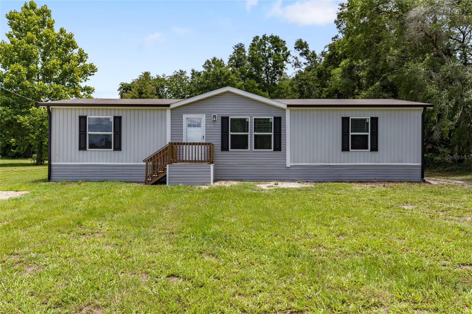 PERFECT FIRST HOME! Brand New 3-Bedroom on Over an Acre—Only 3 miles to Chiefland. Looking for your first home? This move-in ready 3 bedroom, 2 bath home offers everything you need—plus room to grow. Located just 3 miles from Chiefland and only minutes from the natural beauty of Manatee Springs State Park, you’ll love the peaceful country setting with the convenience of town just around the corner.
Step inside and be greeted by a spacious interior with clean lines, thoughtful design and modern finishes throughout. The heart of the home is a dream kitchen featuring a French door refrigerator with ice maker, five burner stove with sleek exhaust hood, an oversized center island with double stainless steel sink and a generous amount of cabinetry. There is even a butler’s pantry for even more storage and prep space!
Adjacent to the kitchen, you’ll find a large laundry room complete with an additional open pantry area. Storage is never in short supply here—every detail was planned with space in mind. Recessed LED lighting runs throughout, adding a crisp modern edge. The spacious master suite includes two walk-in closets, dual vanities and a truly oversized walk-in shower. The split floor plan offers added privacy, with two additional bedrooms—each with their own walk-in closets—and a shared full bathroom on the opposite side of the home. Step through the sliding glass door onto a wide back, perfect for outdoor dining, grilling or simply relaxing. The expansive backyard offers endless possibilities—add a pool, start a garden or create the outdoor space you have always wanted. Built with energy savings in mind, this home includes upgraded insulation, energy-efficient appliances, a hybrid heat pump water heater and a Smart thermostat to help keep monthly costs down. If you are ready for homeownership without the hassle of repairs or updates, this brand new home is ready for you! The features you want, the location you’ll love and room to grow. SCHEDULE YOUR SHOWING TODAY!