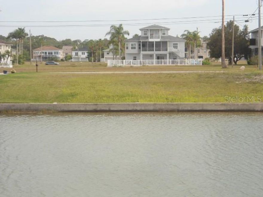 Waterfront lot with SEAWALL located in deed restricted Hernando Beach South. Located three lots from the cul-de-sac you will have views of the Gulf of Mexico when you build. Included in the annual HOA Fee is the grass cutting of the lot up until you break ground to build. Come build you dream home in this waterfront community of upscale homes with access to the Gulf of Mexico. The deed restrictions in the community require you have a seawall in place before you can build.