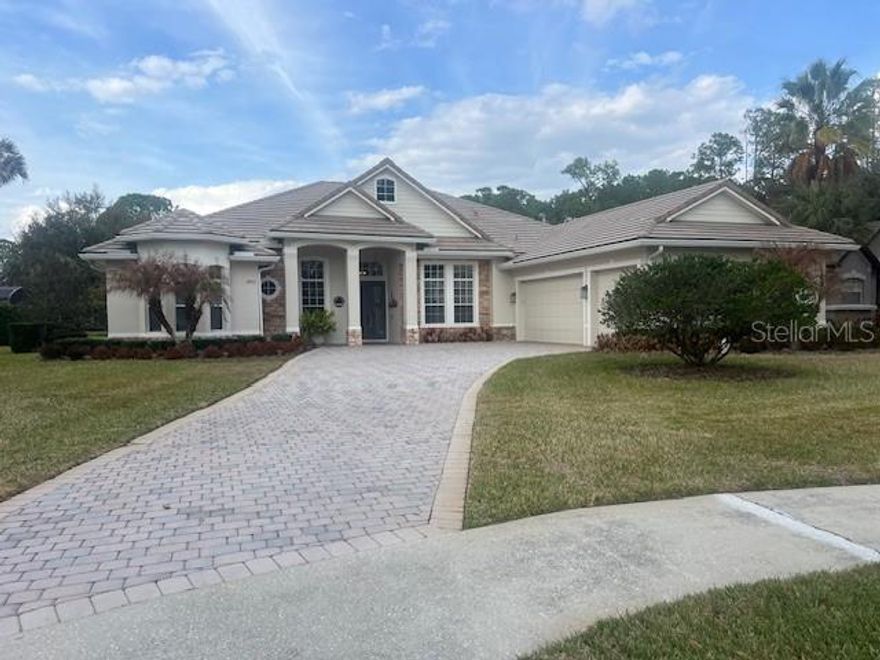 WELCOME to your exquisite, UPSCALE RETREAT in the prestigious GATED community of LOCH LEVEN.  This stunning 3-bedroom, 3-bathroom POOL home embodies LUXURY & ELEGANCE.  As you enter through the double GLASS DOORS, you're greeted by a GRANDIOSE foyer that opens up to a breathtaking view of the SPARKLING pool and tranquil POND through EXPANSIVE glass windows.  The exterior of this STATELY home is equally impressive, featuring a meticulously MANICURED landscape, a brick paver driveway, and a spacious 3-car garage.  The popular one-story split floor plan is perfect for ENTERTAINING, with inviting living and dining rooms adorned with 12' COFFERED ceilings and large windows that flood the space with NATURAL LIGHT.  The office is a masterpiece, boasting a CUSTOM-BUILT WALL UNIT with shelf lighting, wainscoting and tile floors.  The large CHEF'S KITCHEN is a dream come true, BEAUTIFULLY UPDATED with backsplash, lighting, pantry, Advantium oven, dishwasher, BOSCH induction cooktop and refrigerator.  The home offers a PERFECT BLEND of sophistication and comfort, providing an ideal setting for both ENTRTAINING & RELAXATION.  Entertain guests effortlessly with the added space of a STYLISH BAR and dinette area.  Gatherings are a joy in the SPACIOUS family room, featuring 10' ceilings, a cozy stone FIREPLACE, and large windows.  Step outside to your private RESORT-STYLE OASIS, complete with a stunning SALTWATER Pool, hot tub, and EXPANSIVE lanai.  This home is designed for both beauty and relaxation, inviting you to ENJOY life to the fullest.   The OVERSIZED owners' suite is a true retreat, offering 10' ceilings, his-and-her WALK-IN CLOSETS, French doors that open out to the pool, and a LUXURIOUS en-suite bathroom with dual sinks, updated lighting, a garden tub, and walk-in shower.  Two additional SPACIOUS bedrooms and a well-appointed bathroom complete the living quarters, ensuring comfort for all.  Recent updates include: A new Daikin HVAC system 2025, new Pella windows (back of home), new Daikin split AC/heat system in garage, new Concrete tile roof (2025), new granite throughout, garage epoxy flooring.  Located just minutes from HISTORIC downtown Mount Dora, residents of Loch Leven enjoy access to tennis/pickleball courts, basketball courts, playgrounds, picnic areas, RV & boat storage, boat dock and ramp.  Don't miss the chance to make this GORGEOUS home yours-- Schedule an appointment today.