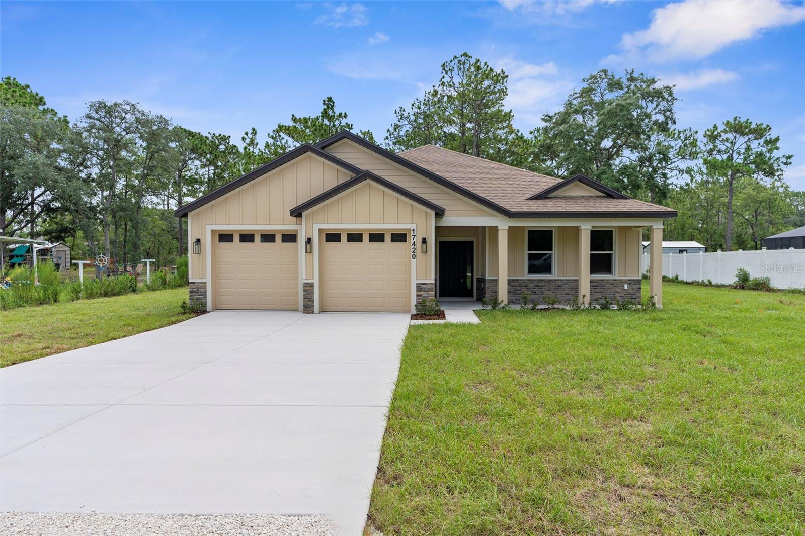 BRAND NEW, Craftsman-Style, Luxury Home!! Completed and Move-in Ready!! PAVED ROAD!! NO HOA!! NO FLOOD!! NO REAR NEIGHBORS!! This STUNNING home offers 4 large bedrooms + 2.5 bathrooms + 2 car garage + large front porch + covered rear lanai in a great location close to shopping and zoned for the county's newest schools (K-12)! This Craftsman-style home with country appeal and stone accents - offers you that southern country feeling! 2,166 sq ft living space; 2,910 total.
The front porch with stone accents greets you and your guests!! Entertain your family and friends in this grand living space which is the centerpiece of the home with a large open great room, island-style kitchen and dining room all with 10' ceilings!! The high ceilings and open space offers you a large open spacious feeling where your family can gather for years to come! Every inch of this custom home is upgraded and attention was paid to every inch and every detail including designer faucets and lighting, upgraded baseboards, upgraded windows/sliders, and continuous Luxury Vinyl Plank flooring throughout the entire home (no carpet)! The upgraded kitchen offers stunning countertops with the modern large, single-level island with breakfast bar big enough for the whole family! Real wood upgraded 42'' soft-close cabinets with a stunning backsplash for that finished luxury look and feel. New stainless steel, upgraded appliances! Generous-sized pantry! The home has a split floor plan offering privacy to the owner's suite with a large ensuite bathroom! The 4th bedrooms is a great option for those who work from home or need that extra room!
The private master bedroom offers a high tray ceiling and an EXTRA LARGE walk-in closet! The ensuite bathroom is a SPA RETREAT in itself with a large stand-alone, modern soaking tub, separate over-sized, floor-to-ceiling tiled walk-in shower and designer shower head and frameless glass, dual sinks, matching real wood upgraded cabinets with framed mirrors, designer faucets and lighting, and a separate toilet room for privacy! There is a half bath off the great room for your guests!! The second bathroom dual sinks and matching luxury finishes! The half guest bath is upgraded, as well, to match the home! Sip your coffee on your large back covered patio in the mornings! Multi-zoned sprinkler system & landscaping! Brand NEW well and septic!! Everything is brand new!!
This stunning Craftsman Home, the Bryan V Model, is offered by LDT Construction!! BUILDER'S 2/10 WARRANTY!! Quality Custom Builder. Other spec homes available; call for details. Minutes from shopping, restaurants, movies, schools, Buccaneer Bay Water Park, kayaking the crystal clear Weeki Wachee River, sunsets at Pine Island, boating, fishing, swimming w/the manatees. 1 hr to Tampa & TOP US BEACHES! **** There are 5 homes on Penn State all by the same quality builder, LDT Construction. Ask to see all 5. Two different models. Gray/White and Warm Beige/White earth tones...are the two color choices.
The only thing you need to do is decorate to make it your own!!