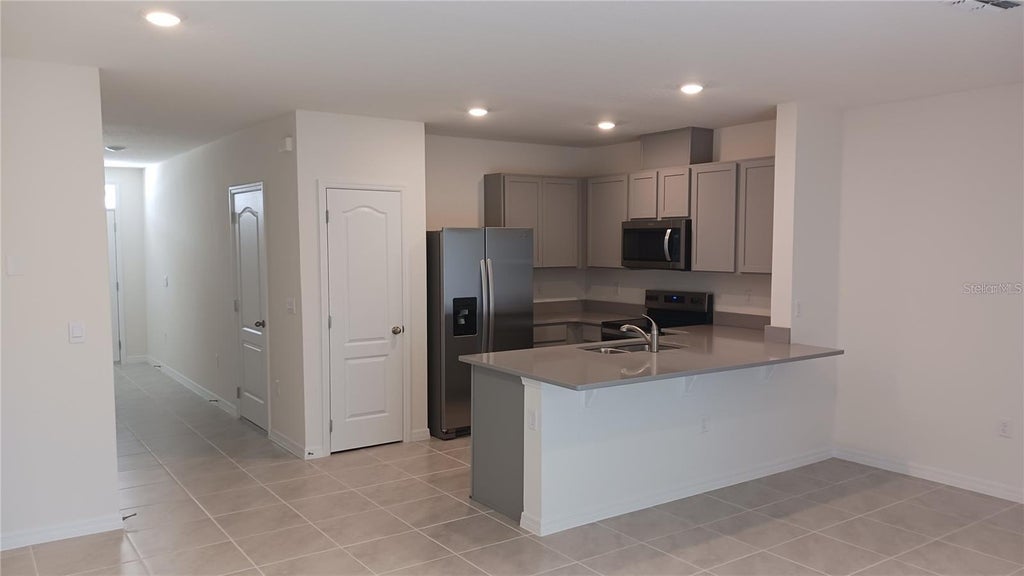 Photo of 1792 Rock Elm Road, Davenport, FL 33837 (MLS # O6448069)