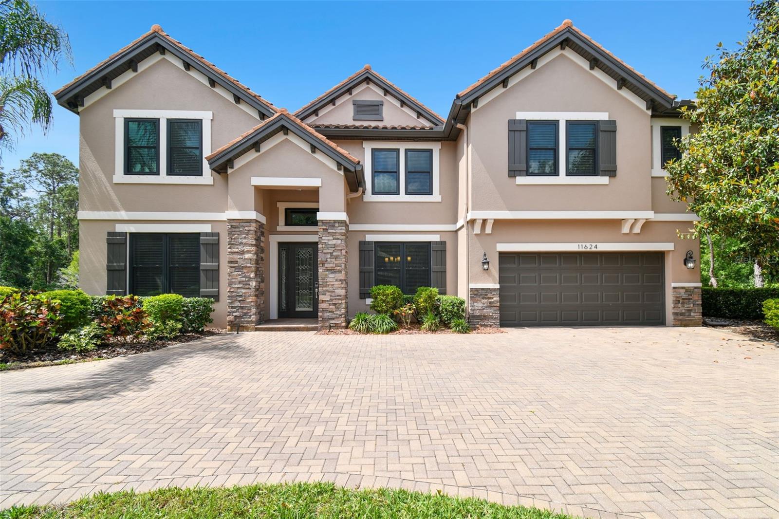 Welcome to your dream home in one of Highland Park’s most exclusive gated communities. This 5-bed, 5.5-bath estate is set on a lush 1-acre lot surrounded by conservation and a private pond—offering rare tranquility just minutes from top-rated schools, shops, and dining.
Inside, enjoy almost 5,300 sq ft of beautifully designed living space with a first-floor primary suite, office, spacious family room, gourmet kitchen with large island, and elegant finishes throughout. The first-floor primary suite includes a spa-like bath and custom walk-in closet. The gourmet kitchen boasts a large center island, wood cabinetry with crown molding, stainless steel appliances, walk-in pantry, and adjacent coffee station. Enjoy open living spaces with beautiful views of the saltwater pool, covered lanai, and tranquil backyard with firepit overlooking conservation and a pond, perfect for relaxing under the stars. Upstairs features a huge bonus/game room, wet bar, media room, and 3 additional bedrooms, two with en-suite baths and a separate third bathroom.
Upgrades and Features:
• NEW hurricane-impact windows
• Generac 22kW whole-house generator
• EV charger
• Custom closet systems
• Water softener + whole-house filtration
• Security cameras w/DVR
• Low energy bills (avg. $200/month) - Energy Star rated home
• Brick-paved circular drive & 3-car garage
Enjoy community perks like a lakeside clubhouse, fitness center, pool, parks, and dock for kayaking/fishing. This is more than a home - it's a lifestyle. Combining luxury, privacy, and prime location, this one-of-a-kind property truly checks every box. Don't miss the opportunity to make it yours - schedule your private showing today.