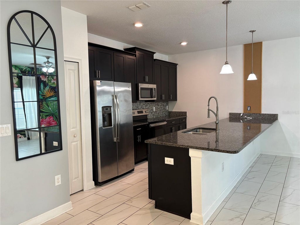 Photo of 1591 Moon Valley Drive, Davenport, FL 33896 (MLS # O6426051)