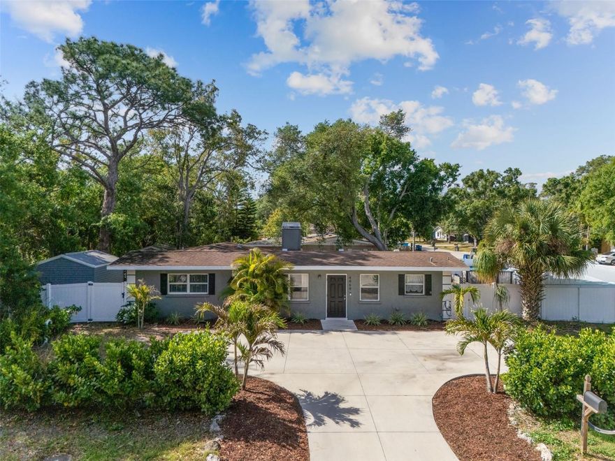 One or more photo(s) has been virtually staged. Welcome to 4060 Webber Street—an ideally located Sarasota home offering convenience, flexibility, and access to some of the area’s most sought-after outdoor amenities. Just moments from the Legacy Trail, the Sarasota Springs Trailhead, Downtown Sarasota, UTC, and world renowned beaches.  This property is perfect for those looking to enjoy all that the Florida lifestyle has to offer. The home features a comfortable layout with inviting living spaces and plenty of natural light, enhanced by luxury vinyl plank flooring throughout the main living areas and primary bedroom for a clean, modern feel. The living room is anchored by a cozy wood-burning fireplace, creating a warm focal point for relaxing or entertaining. The spacious, open kitchen offers ample room for cooking, gathering, and hosting, making it the true heart of the home. The property features a fully fenced yard with a double gate on the side, providing direct access to a concrete pad—ideal for storing a boat, trailer, or additional vehicles. With no HOA restrictions, you’ll enjoy the freedom to make the most of your property without added limitations—whether for personal use or investment purposes. Located just a short drive to Siesta Key, downtown Sarasota, shopping, dining, and major roadways, this home combines accessibility with lifestyle appeal. Don’t miss this opportunity to own a versatile property in a prime central Sarasota location