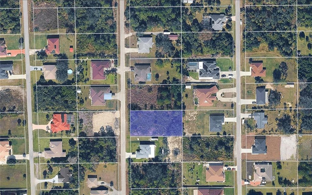 Photo of 610 Mckinley Avenue, Lehigh Acres, FL 33972 (MLS # TB8457443)