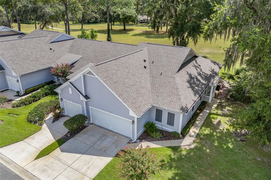 You've found it, community combined with privacy in a unique custom setting. END UNIT with NEW ROOF and 2 car garage in the Villas of West End with over 1700 sq ft overlooking green space. Welcome Home to this 2 bedroom / 2 bathroom with large flex space great for office, dining area or easily converted to another bedroom. The home showcases Mid-Century Modern custom built-ins, trey ceiling and French doors offering tranquil views of the expansive green space. The open floorplan provides a smooth transition to the kitchen with stainless steel appliances, granite countertops, abundance of cabinets with pull-out shelves, corner turntables and soft-closing doors and drawers, pantry and built-in counter for additional seating. The serene primary bedroom shares views of green space, large walk-in closet and en-suite bathroom with double sinks, soaker tub and separate shower. Second bedroom includes double wall closet with built-in desk and shelving, conveniently located across from second full bathroom with tub/shower combo. Flex room currently used as dining room, has custom cabinetry and can easily convert to mixed-use or third bedroom. Multiple large closets throughout for extra storage. Laundry room features custom  built-in cabinets with desk area and washer/dryer. Conveniently located to grocery, shopping, entertainment and dining. Easy commute to I-75 and Bus Route nearby. HOA fee covers roof, exterior maintenance, landscaping and pest control. The Villas of West End community includes two pools, clubhouse, pavilion, tennis & pickleball courts. **Adjacent property is county owned and will remain designated green space/recreational use.
