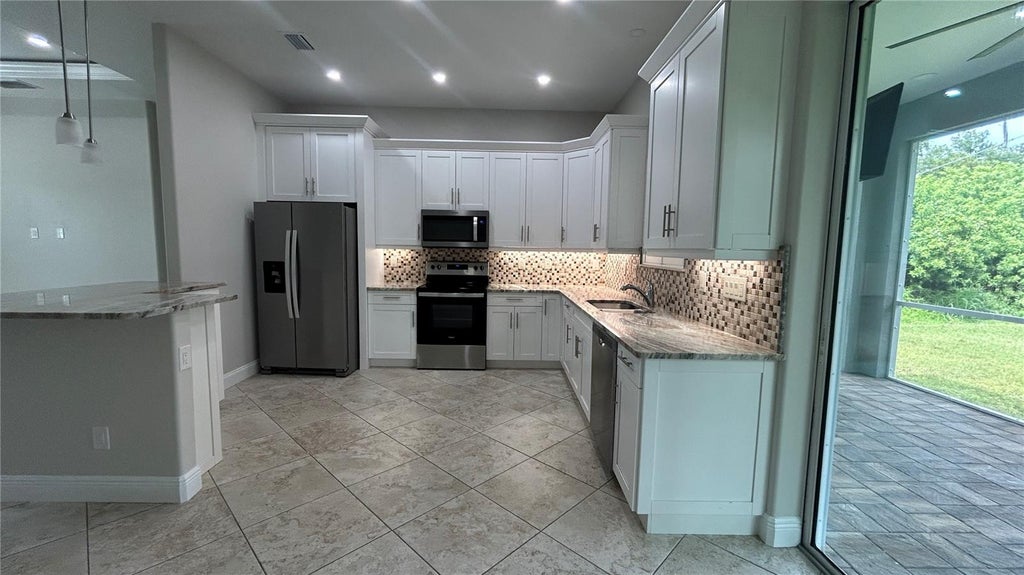 Photo of 20246 Gladstone Avenue, Port Charlotte, FL 33952 (MLS # C7531426)