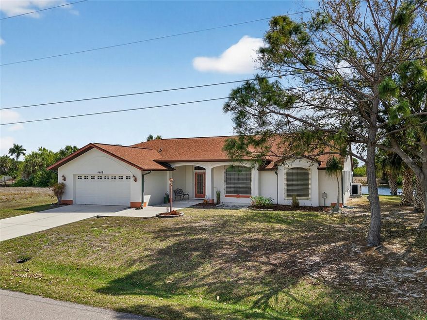 TURNKEY! QUICK WATER ACCESS! Spacious 3 bedroom, 2 bath, 2-car garage waterfront pool home in popular boating section of Port Charlotte! 80’of waterfrontage on deep wide turning basin with concrete seawall, dock and powerboat access to Charlotte Harbor leading to the Gulf! Step inside through French doors to 1,978 sf of living area, high ceilings, tile flooring in main living areas, separate large den or office and pocketing slider to serene water views in living room. Kitchen features ample counter space and cabinetry, tile backsplash, built-in desk, breakfast bar and overlooks casual dining area with bay-style window to enjoy the pool and water views. Split floor plan provides privacy for all including a generous primary suite with private bath offering dual sinks, garden tub and walk-in shower plus a separate hall leads to two guest bedrooms and shared full hall bath. Step outside to covered lanai and panoramic screened heated saltwater pool with southeastern exposure so your guests from the north can enjoy an abundance of Florida sunshine. An open outside patio is great for grilling and there is a convenient walkway for access to dock. Additional features include new roof and ac in 2020, hot water heater in 2024 and hurricane protection. Quiet neighborhood close to restaurants, shopping, schools, Port Charlotte Beach Park, Charlotte Harbor and just a short ride over the bridge to downtown historic Punta Gorda with award winning fishing and boating, beautiful parks, community events and entertainment. Don’t miss the opportunity to make this your new Florida retreat or permanent home! Schedule your private showing today!