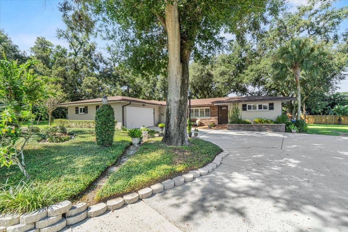 Spacious South Lakeland Home on Over Half an Acre!
Tucked away at the end of a cul-de-sac, this 3-bedroom, 2-bath home built in 1965 offers 2,612 sq. ft. of living space on
a beautiful 0.55-acre lot shaded by majestic grandfather oaks. The large, fenced backyard features two metal sheds, a
pole barn—all wired with electricity—and a huge covered and screened patio, perfect for entertaining.
Updates include a new roof (2023), new windows (except in the added family room), gutter guards (2023), HVAC (2018
& 2010), and dual water heaters (both 2018), including one dedicated to the primary suite. The septic system was
cleaned and serviced in 2018 with an additional riser added. The privacy fencing has been replaced, a 4-zone irrigation
system. Inside, the expansive family room is ideal for gatherings. The kitchen boasts granite countertops, stainless steel
appliances, a breakfast bar, and a dinette with built-in cabinetry.
This South Lakeland gem offers space, updates, and a great location—ready to welcome its new owners!