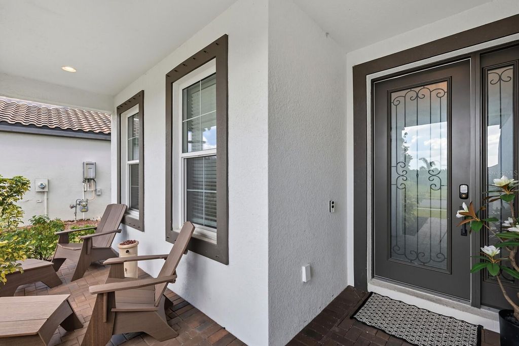 Photo of 2033 Woodleaf Hammock Ct, Bradenton, FL 34211 (MLS # A4666825)