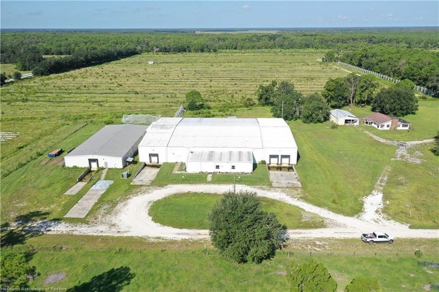30,000+-SF Blueberry Packing House w/ Equipment, 83+-High-fenced Farm turn-key with irrigation/wells Home/ Barn All Vacant & Priced to Sell Fast with a Proforma Cap Rate of 12% & Breakup Allocation of value at $3M+-! Air Conditioned Packing House is in Excellent Condition while the farm have some deferred maintenance. Packing Facility: 1600+-SF finished office at front middle with multiple private offices/conference rooms/public ADA restrooms then leads to the main packing area of 20K+ SF with equipment & some packing supplies then two 18+-Ft high ceiling like new loading processing areas with exterior sunken docks / high roll up doors for semi’s both located on each end of the main bld. Two docks on north end & one dock on the south end. Large separate but connected bld to the adjacent south with it’s own loading dock. All bld.’s are completely air conditioned. See multiple A/C units along the rear of this facility. Blueberry farm has 14” well 1300+-Ft deep at the south middle with surface water well at rear & 2” well at the north all watering all at once for cold protection (overhead & drip irrigation).. Farm has all irrigation in place and bedded with boundaries completely high fenced & some netting remaining. Some deferred Maintenance & storm damage to pump shed, barn by home & home itself needs to be completely updated. Packing House may have potential capacity to handle 1.5 million LB's of Blueberry production which could account for up to 200 acres of crop land with 54+-acres here on site all subject to many variables / conditions of course.