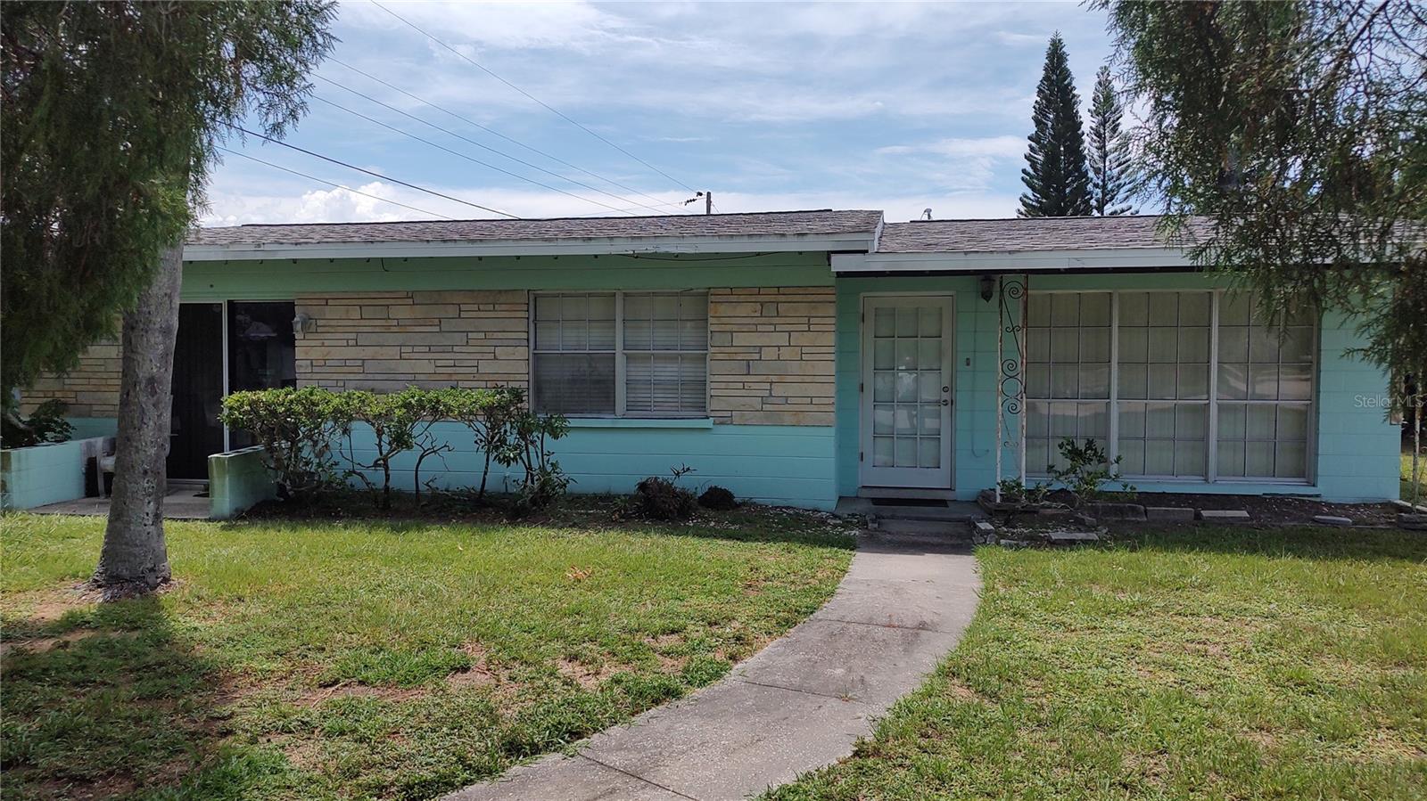 Great Nokomis location close to Casey Key Beach, Shopping and Sarasota. Newer Vinyl flooring, new roof this year. Large 2 car garage. This home is currently set up as two living units so it would be a great place for multiple generations living together and having their private space.
Can also be converted back easily. It is now a 1 bedroom, 1 bath plus a combo living kitchenette with entrance on Tangerine Dr. With a separate entrance on King St. you have a large 1 bedroom 1 bath with another bonus room currently used as the 2nd bedroom with a full kitchen and full living room and dining area. Laundry room between the living area and garage. This home is connected to county water and is on a septic but sewer is available. Third nail has been added for the insurance discount.