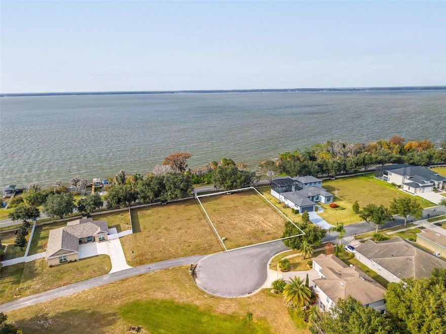 Build Your Dream on the Chain of Lakes – Homesite + 100’ Deeded Lakefront Included. A truly rare opportunity to create the lake lifestyle you’ve been dreaming of. This unique property offers a .52-acre homesite within the gated community of Etowah, along with a separate deeded lakefront parcel directly across Lake Shore Drive, featuring 100 feet of frontage on Lake Eustis—part of the highly sought-after Harris Chain of Lakes**. Design and build your custom home on the interior lot, then take full advantage of your private waterfront parcel—ideal for a future boathouse and direct access to endless boating, fishing, and waterfront adventures. From early morning cruises to unforgettable sunset views over Lake Eustis, this property delivers the true Florida lakefront experience. Ideally located just minutes from downtown Tavares, you’ll enjoy convenient access to waterfront dining, shopping, and everyday essentials, as well as nearby medical facilities including AdventHealth Waterman. Within Etowah, residents benefit from a range of amenities including a community pool, tennis courts, basketball court, playground, and scenic sidewalks—all included in the HOA. Properties that offer both a buildable homesite and separate deeded lakefront access on the Chain are exceptionally hard to find. Whether you’re envisioning a full-time residence or a seasonal retreat, this is your chance to secure a one-of-a-kind setting. Bring your builder, explore the possibilities, and start planning your future on the water. Schedule your private showing today and experience the potential for yourself.