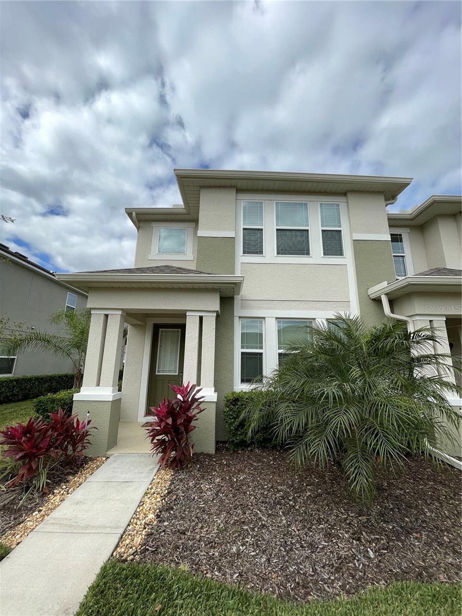 Check this home out! Freshly painted last year in “North Star” inside, and luxury vinyl plank flooring in this end townhouse just minutes away from theme parks and great shopping at Legado community in Windermere. 3 spacious bedrooms, and 2.5 bathrooms combine with generous living space in this 2-story townhome. Designed for entertaining, the "Minneola" features a large gathering room bathed in natural light and complimented by an inviting dining space and sizeable kitchen together with 42” cabinets and Stainless Steel appliances. High efficiency washer and dryer are included. Massive walk-in closets, vaulted ceilings, and private access to this floorplan's covered balcony makes the master suite the perfect oasis to relax in. Community features a pool, cabana, “tot lot” playground which are just steps away from the front door, and walking trails for your family’s enjoyment. This is a “must see” home to appreciate everything it has to offer!