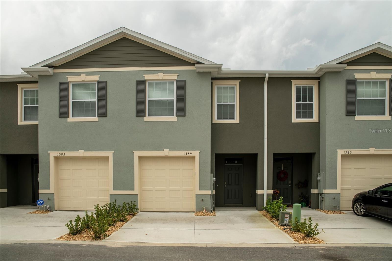 This stunning 3-bedroom, 2.5-bathroom townhome, built in 2022, offers 1,720 sq. ft. of beautifully designed living space, perfect for modern comfort and style. Located in the excellent Atria at Ridgewood Lakes community, this home features an open-concept kitchen with stainless steel appliances and a central island, ideal for entertaining. The spacious living area seamlessly connects to a covered lanai through a three-panel sliding door, allowing you to relax. The community offers great locations you’ll be just minutes away from shopping, dining, and world-famous Orlando attractions! Don't miss the chance to call this luxurious retreat your home.