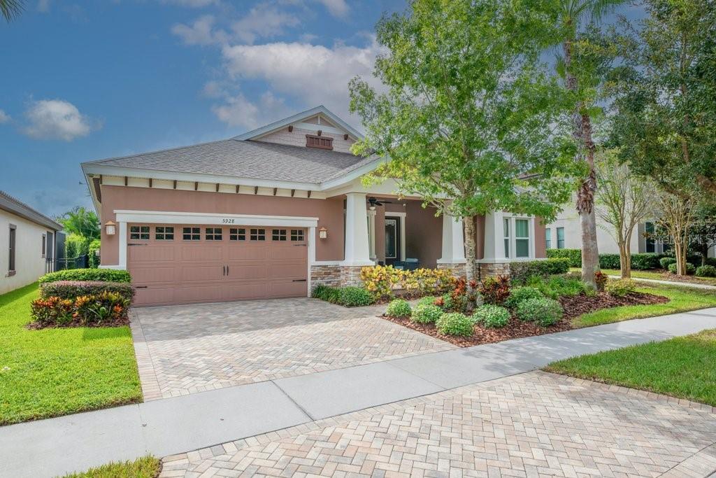 West Bay Built | Popular Biscayne III Plan | 3-Car Garage | FishHawk Ranch
Welcome to this stunning one-story Craftsman-style home in the highly sought-after FishHawk Ranch community, perfectly positioned to overlook tranquil greenspace and the community park. This exceptional residence offers nearly 2,700 sq ft of upgraded living space, featuring 4 spacious bedrooms, 3 full baths, an extended screened lanai, and a 3-car tandem garage. Charming curb appeal greets you with custom brick pavers, an oversized front porch, and lush landscaping. Inside, you’ll be impressed by the elegant foyer, soaring 12-foot ceilings, 8-foot doors, crown molding, and upscale finishes throughout. The gourmet kitchen is a chef’s dream—offering an oversized island, extended cabinetry with soft-close drawers and lower pull-out shelves, tile backsplash, under-cabinet lighting, built-in oven. microwave and cooktop, walk-in pantry, and ample storage space. The expansive family room features a tray ceiling, floor outlet, built-in surround sound speakers, and seamlessly opens to the outdoor living area—ideal for entertaining. The private owner’s suite is a true retreat, complete with a bonus sitting room (perfect for an office, nursery, or workout space), closet + walk-in closet, and a spa-inspired en suite bath with garden tub, walk-in shower, dual vanities, and a dedicated make-up vanity. This split floor plan provides privacy for all, with generously sized secondary bedrooms. Bathroom 2 includes a walk-in shower; bathroom 3 offers a tub/shower combo. Additional highlights include a large laundry room with sink, folding station, and storage, TV mount on the lanai and 2 ceiling fans, guest parking, and a 3-car garage with epoxy flooring, overhead storage racks, and a side service door. Enjoy resort-style living with top-rated schools just a short walk away, and world-class community amenities including community pool & splash pad, fitness centers, playgrounds, dog parks, scenic trails, and The Lake House activity center w/billiard tables, ping pong, fire pit and More! Conveniently located near shopping and dining. Just a short drive to downtown Tampa, MacDill AFB, The Magic of Orlando, Golf Courses and Gulf Coast beaches—this is truly a must-see home in a premier location!