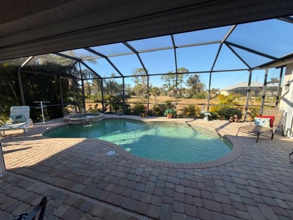 Photo of 123 White Marsh Lane, Rotonda West, FL 33947 (MLS # TB8474403)