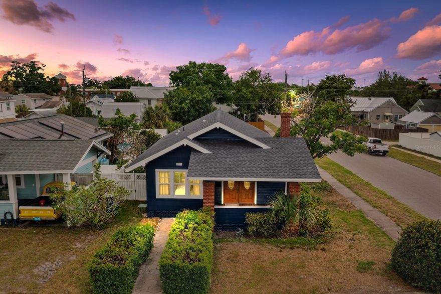 Tucked into the heart of Kenwood, just four blocks off Central Ave, this fully remodeled 2 bedroom, 2 bathroom home delivers the perfect blend of location, style, and peace of mind. Enjoy true walkability to some of St. Pete’s favorite local spots including Wild Child, Baba, and Bandit Coffee Co. all just minutes from your front door. Inside, the home has been thoughtfully renovated from top to bottom with major system upgrades already completed, including a new roof, AC, plumbing, and electrical, giving buyers confidence for years to come. The interior features brand new flooring throughout and a stunning, designer kitchen outfitted with Taj Mahal quartz countertops, stainless steel appliances, and warm wood-tone shaker cabinetry. Both bathrooms have been fully updated with clean, modern finishes that complement the home’s overall aesthetic. Step outside to a private, fully fenced backyard designed for entertaining, where a custom pergola creates the perfect focal point for gatherings, dining, or relaxing evenings. The property also offers a detached one-car garage plus a rare bonus, a concrete parking pad ideal for a boat, trailer, or small RV. With its unbeatable Kenwood location, extensive upgrades, and thoughtful indoor-outdoor living, this home checks all the boxes for buyers looking to enjoy the best of St. Petersburg living.