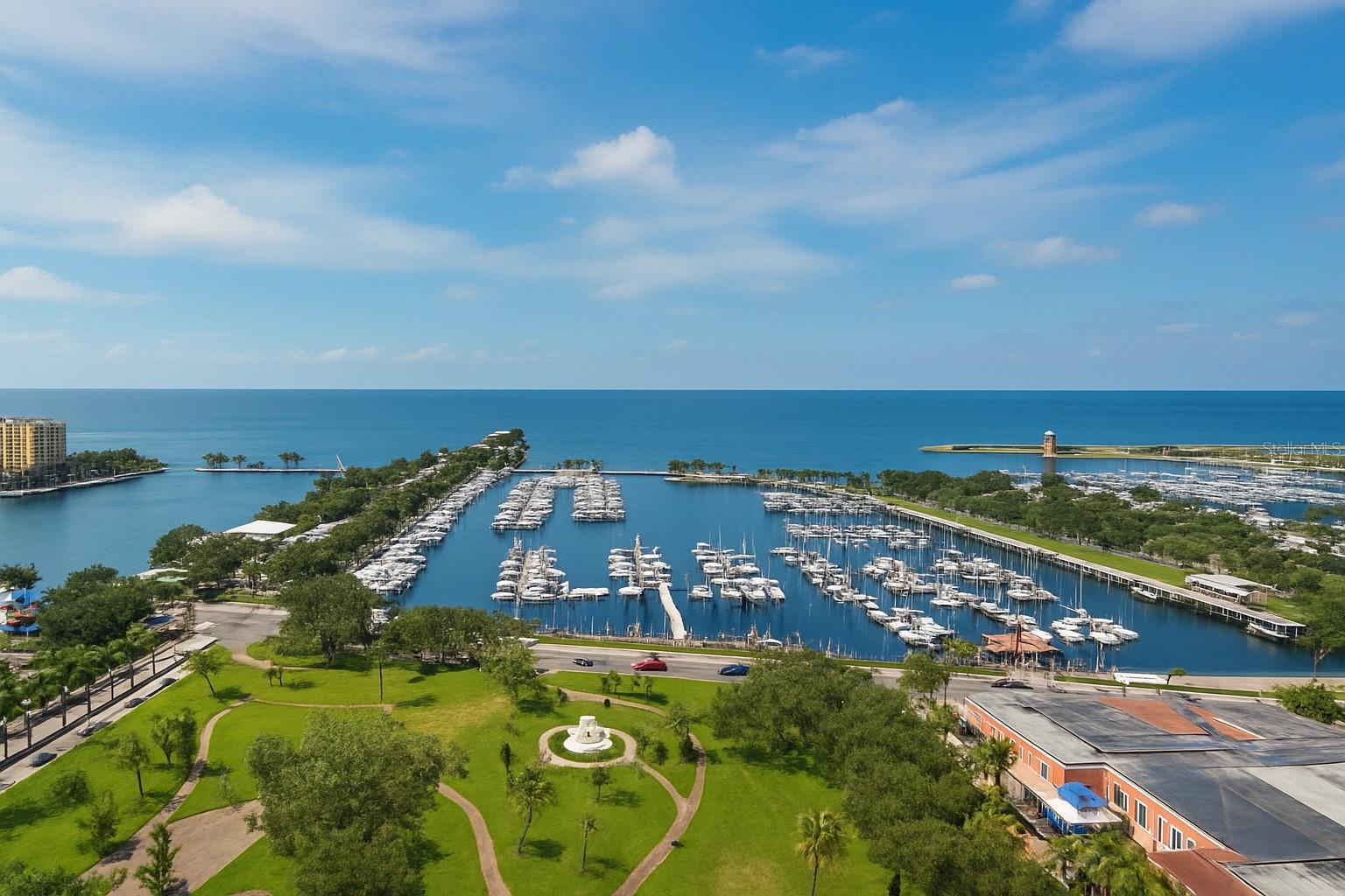 Enjoy some of the best views St. Petersburg has to offer from this elegant residence in one of the city’s most desirable towers. The “02” line is the most sought-after in The Florencia, facing directly toward the water with wide-open, unobstructed views of Tampa Bay and the downtown waterfront. From the 19th floor, the vantage point is exceptional, with the expanse of the bay stretching out by day and the St. Petersburg Pier beautifully illuminated at night.
A wall of windows spans the main living area, kitchen, and owner’s suite, fostering constant enjoyment of the stunning views. Two private balconies frame the waterfront and provide perfect spots to take in the bayside breezes with morning coffee as the sun rises out of the bay or evening beverages as the Pier comes alive with light. Gorgeous walnut floors with a stunning hand-cut inlay set the tone as you enter the grand foyer, leading to open living and dining spaces highlighted by three oval tray ceilings in the foyer, dining room, and living room for architectural elegance. The kitchen offers abundant storage, granite counters, and a suite of Viking appliances, including two built-in microwaves—perfect for warming leftovers from the endless array of celebrated restaurants just steps away. The dining room easily accommodates twelve for formal gatherings, and the home is richly detailed with extensive built-ins, fine woodwork, and crown moldings that carry throughout. The master suite is beyond luxurious, with a generous bedroom that provides room for both a large bedroom set and a sitting area, incredible water views, and direct access to its own balcony. Of the three bedrooms, one is currently configured as a media room and another as an office, which could easily be converted back to a bedroom. The home is full of thoughtful details to enhance entertaining and day-to-day living, including a living room wet bar, a full electronics suite, and more.
Since its construction in 2000, The Florencia has been one of the most desirable buildings in the Tampa Bay area. Built by renowned local developer JMC Communities and supported by a famously well-run association, it offers 24-hour concierge service along with amenities that include a pool, spa, fitness center, and elegant social rooms. Its prime position on Beach Drive places the best of downtown St. Petersburg at your doorstep, from waterfront parks and galleries to fine dining and the St. Petersburg Yacht Club. Two garage parking spaces and a private storage unit are included.