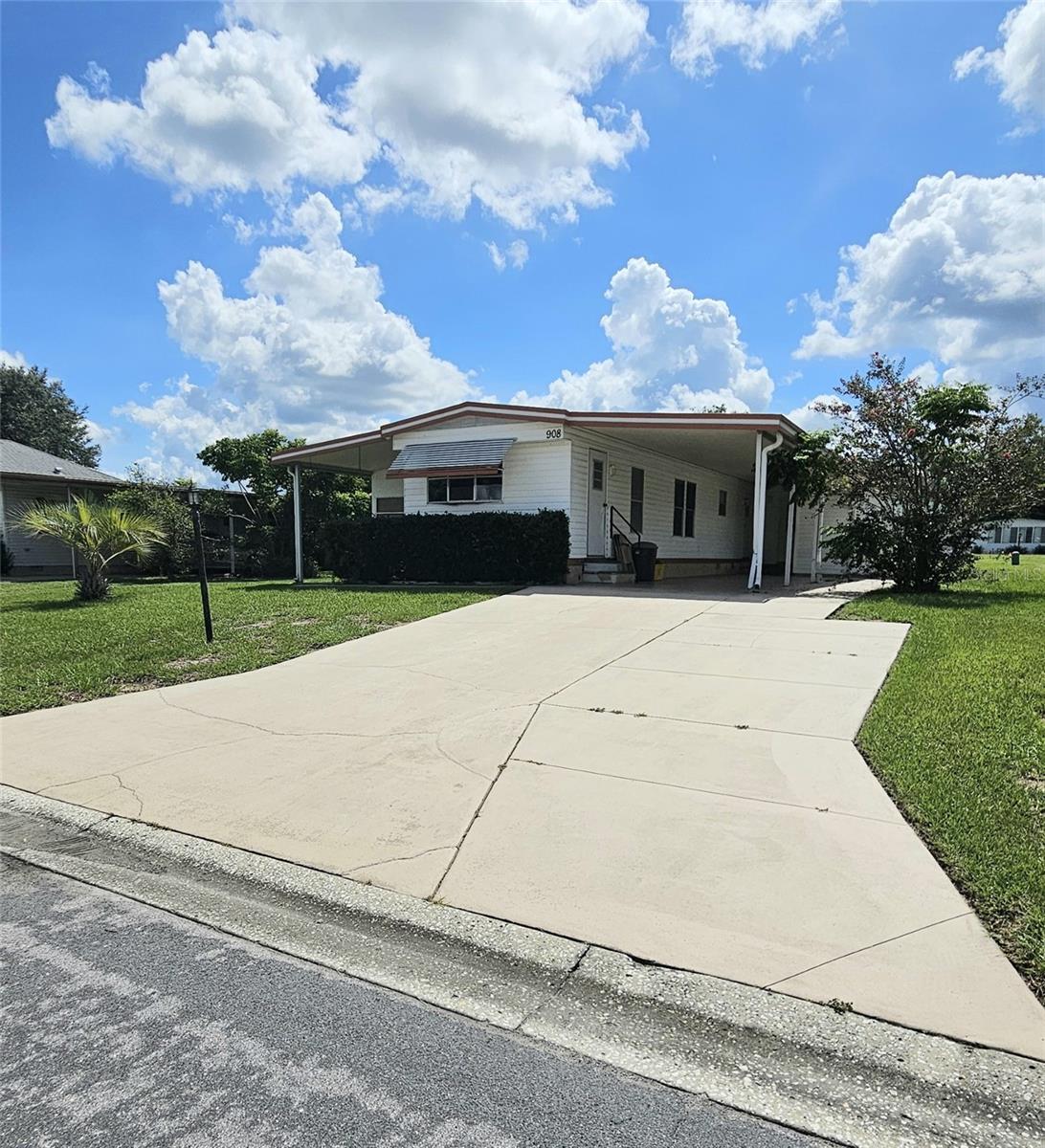 Looking for an inexpensive home giving you access to all The Villages Lifestyle has to offer? Then this diamond
In the rough is waiting for you to make it shine! This home features a galley kitchen with small breakfast bar, a
Living Room/Dining Room Combo, 2 Bedrooms, 2 Baths, One being an In-Law Ensuite with it's own entry from
outside that was added to the original home. There is an additional smaller room perfect for a Home
Office/Den. This 8X8 room needs sub flooring replaced. Boxes of tile are provided to finish off this space.
Other features of this home include a 10 X 19 Florida Room, Exterior Laundry room with storage, plus, the must
have 11 X 13 Carport large enough for Two Cars and Golf Cart. You can make this little Gem into your Winter get
away, or a year round retreat, with a little elbow grease!! Location is surrounded by Restaurants, Shopping,
Entertainment, and Medical Facilities. The Villages also offers multiple Pools and Golf Courses, plus Recreation centers,
Softball Fields, Pickle Ball and Tennis Courts, just to name a few. Come take a look, you'll be glad you did!