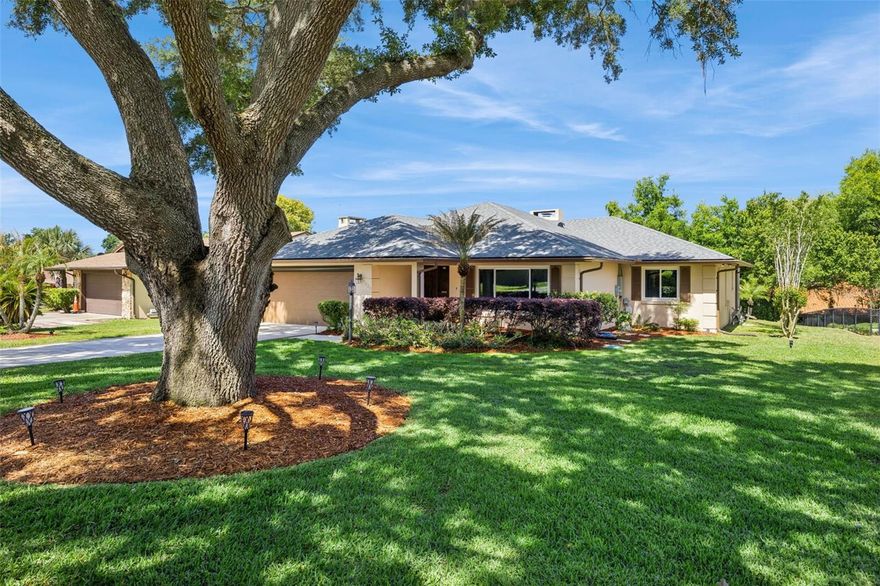 Rare opportunity in Springwood Landing—now offered at a newly adjusted price point and positioned as one of the best values in the neighborhood—with lake access, peek-a-boo views of Lake Eustis, and all the big-ticket items already done. This 3 bedroom, 2 bathroom home offers peek-a-boo views of Lake Eustis, a spacious lot, and the kind of updates buyers are actively searching for.
What truly sets this home apart is that the major components have all been permitted and updated—including windows, roof (2021), electrical panel (2022), and HVAC (2024). These aren’t just upgrades—they’re the core systems buyers care about most, already handled with proper permits for added peace of mind.

Inside, you’ll find a true split floor plan offering privacy between the primary suite and guest bedrooms, along with two distinct living areas—a main living room and a separate sitting area centered around the fireplace. Windows in this space frame peek-a-boo views of Lake Eustis, and an additional bedroom also captures views of the lake—bringing that connection to the water into multiple areas of the home. Natural light flows throughout, and the layout transitions easily to the screened patio for effortless indoor-outdoor living.

Out back is where this home really shines. With west-facing exposure, you’ll enjoy beautiful sunset skies from your own backyard, whether you’re relaxing on the patio or unwinding in the included hot tub from Spa Kingdom. The yard is spacious and surrounded by mature trees, offering both privacy and that established neighborhood feel.

Located in the highly desirable Springwood Landing community, residents enjoy private access to a dock on Lake Eustis, part of the Harris Chain of Lakes—ideal for boating, fishing, or simply enjoying time on the water. All just minutes from downtown Eustis and Mount Dora, with waterfront parks, dining, and shopping nearby.

Homes in this neighborhood rarely feature this combination of layout, lake views, and sunset-facing outdoor living—making this one truly stand out.