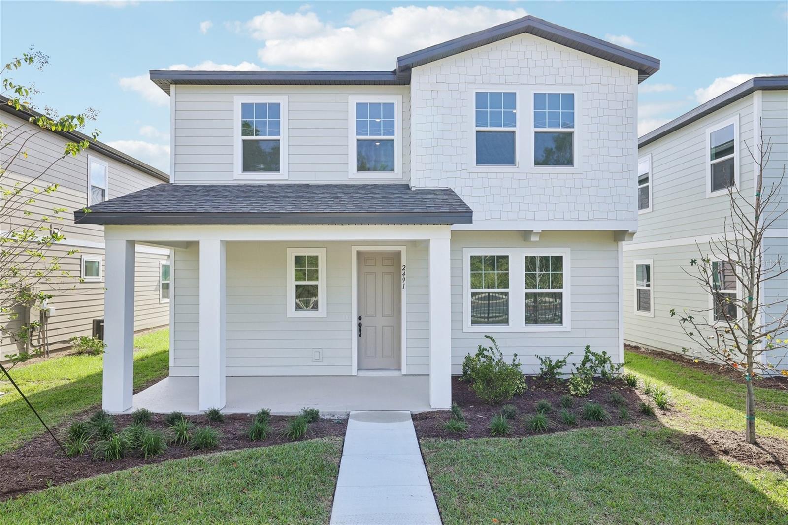 Welcome to this beautifully designed two-story home in the charming community of Ellington Place in St. Cloud. This open-concept floorplan offers 4 bedrooms and 3 full baths, providing plenty of space for both relaxation and entertaining. The home features wood-look vinyl plank flooring throughout the main living areas and a rear-load 2-car garage that enhances curb appeal. The modern kitchen is the heart of the home, showcasing 42" cabinetry, quartz countertops, a stylish tile backsplash, and stainless steel appliances, including a range, microwave, and dishwasher. Designed with both style and function in mind, this home reflects exceptional craftsmanship and thoughtful detail throughout. Enjoy life in a quaint community with low monthly HOA fees and no CDD, conveniently located near SR 417, Lake Nona, and the Sunbridge area, offering easy access to shopping, dining, and top-rated schools.