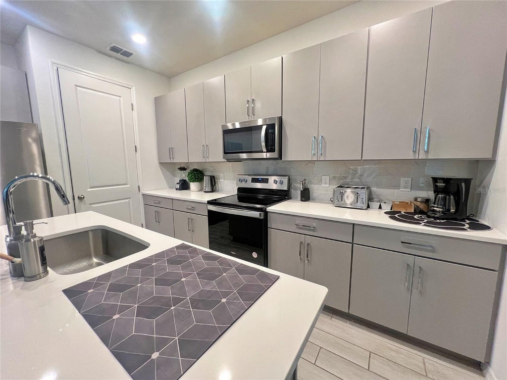 Photo of 844 Benoi Drive, Davenport, FL 33896 (MLS # TB8546275)