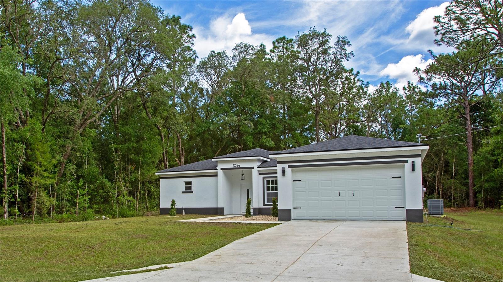 MOVE IN READY___Over an acre of land__ This is a Stunning, Modern 3/2 PLUS a BONUS ROOM that could be used as a 4th Bedroom. The elegance in this home boosts over $15k in upgrades and is located in the beautiful Rolling Hills. (Block construction) ** Builder offers extended 2-10 warranty. The kitchen features solid 42" Shaker wood cabinets, soft close, Quartz Island, European Modern Faucets, beautiful backsplash & Modern finishes, stainless steel appliances, pantry, and a beautiful dinning area that overlooks the backyard nature through the window. WATERPROOF Luxury vinyl plank floor throughout all the home. ***The Master bedroom offers lots of space with tray ceiling and a EXTRA Large Walk In Closet. Come see the stunning oversized shower with Rain Head & European drain. His and hers vanities (with Waterfall Faucets & Quartz conters) give extra space to the buyer with anti fog/light up rounded Mirrors. Separate toilet room. The other side of the home features 2 guest bedrooms with large windows, guest bath with tub/shower with European Waterfall Faucets and linen closet. Large inside laundry room and 2 extra storage closets on the hall for the family needs. All throughout the home you have upgraded light and plumbing fixtures. The covered front and back patio invite to enjoy the quiet of this neighborhood. Oversized 2 car garage. Stunning backyard for all your entertainment or storage needs. Home is ready for your family and all your toys. Ride the ATV through the neighborhood, park the rv on your large 1.2 acre property. Located in Rolling Hills, close to Supermarkets, Restaurants , WEC, HITS, Rainbow River and more.