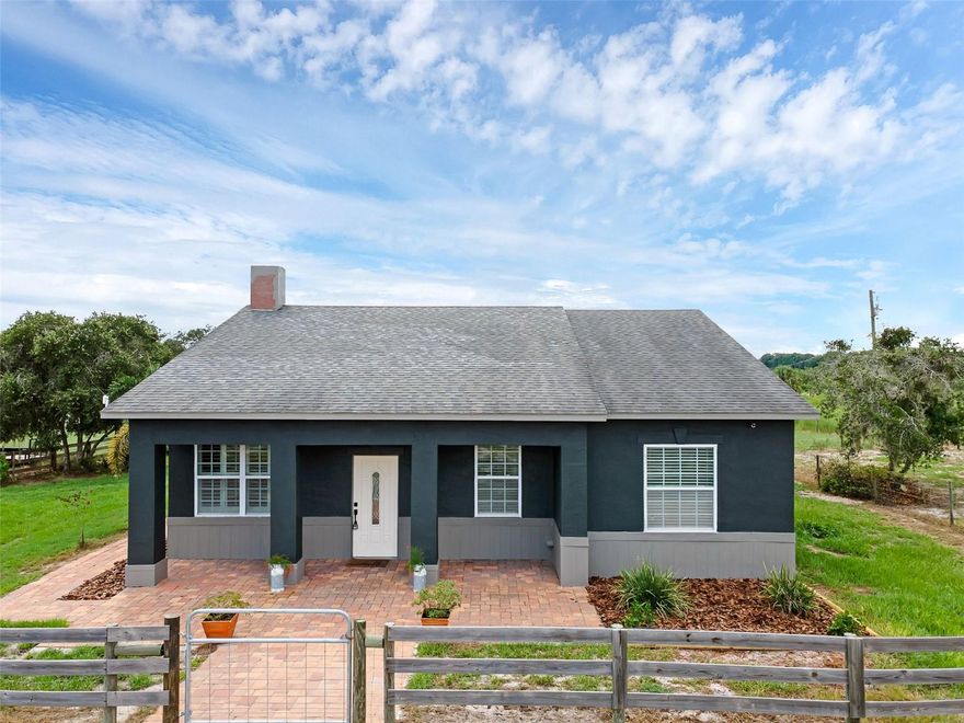 DON'T MISS THIS opportunity to own this delightful 3 bedroom, 2 bath home in a rural gated community of Frostproof, FL. The home is situated on 3.01 acres with fencing, and located in Blue Jordan Forest, a wildlife-designated community. The home has a desirable open concept, split bedroom plan, high ceilings and great outdoor living space! The seamlessness of the interior layout enhances the sense of spaciousness while linking to the great outdoors of the screen lanai, patio and cabana. The kitchen features sleek contemporary cabinets topped with beautiful granite counters, an island with seating, a pantry and stainless appliances. The spacious master bedroom offers a roomy retreat complete with a generous walk-in closet and its own en suite bathroom with handsomely tiled shower stall. The second bathroom stands convenient to the living areas and the additional bedrooms; beautiful tile plank floors stream throughout the home enhancing the connectivity of the floorplan. The wide front walkway and covered porch exudes a warm welcome; the back patio, with firepit and cabana provides comfort, relaxation and an enjoyable area for family and guests. This rare 3-acre property, in a private gated community offers the utmost of tranquility and privacy. Bring your horses and enjoy the seclusion of the forest, nearness to Lake Reedy, Lake Walk-In-Water and Wildlife Management Area with access to hiking trails and horse trails! This Central Florida location is just minutes to the towns of Frostproof, Avon Park and Lake Wales. Nearby major highways, US Hwy 27 & SR Hwy 60 lead to Florida beaches and metros of Tampa-Orlando-Miami.