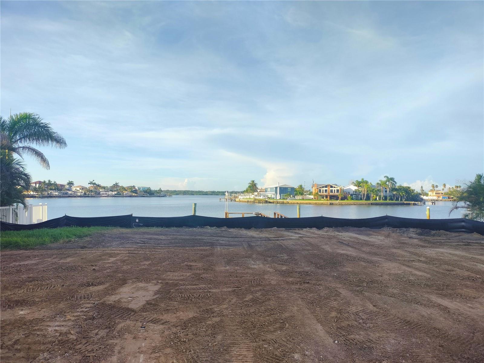BUILD YOUR PERSONAL PARADISE IN REDINGTON BEACH! This 75x100 rectangular lot features a beautiful unobstructed view of the intercoastal, and boat assess to John's Pass and then out to the Gulf. Newer seawall done in 2021. Many new homes have been built in this area on lots such as this one....so build your dream waterfront home right here! A short drive to lovely St. Pete and Tampa. Multiple parks and beach accesses are within walking distance. Walking distance to local shopping/restaurants. This land is ready for you to make your waterfront living dreams come true!
