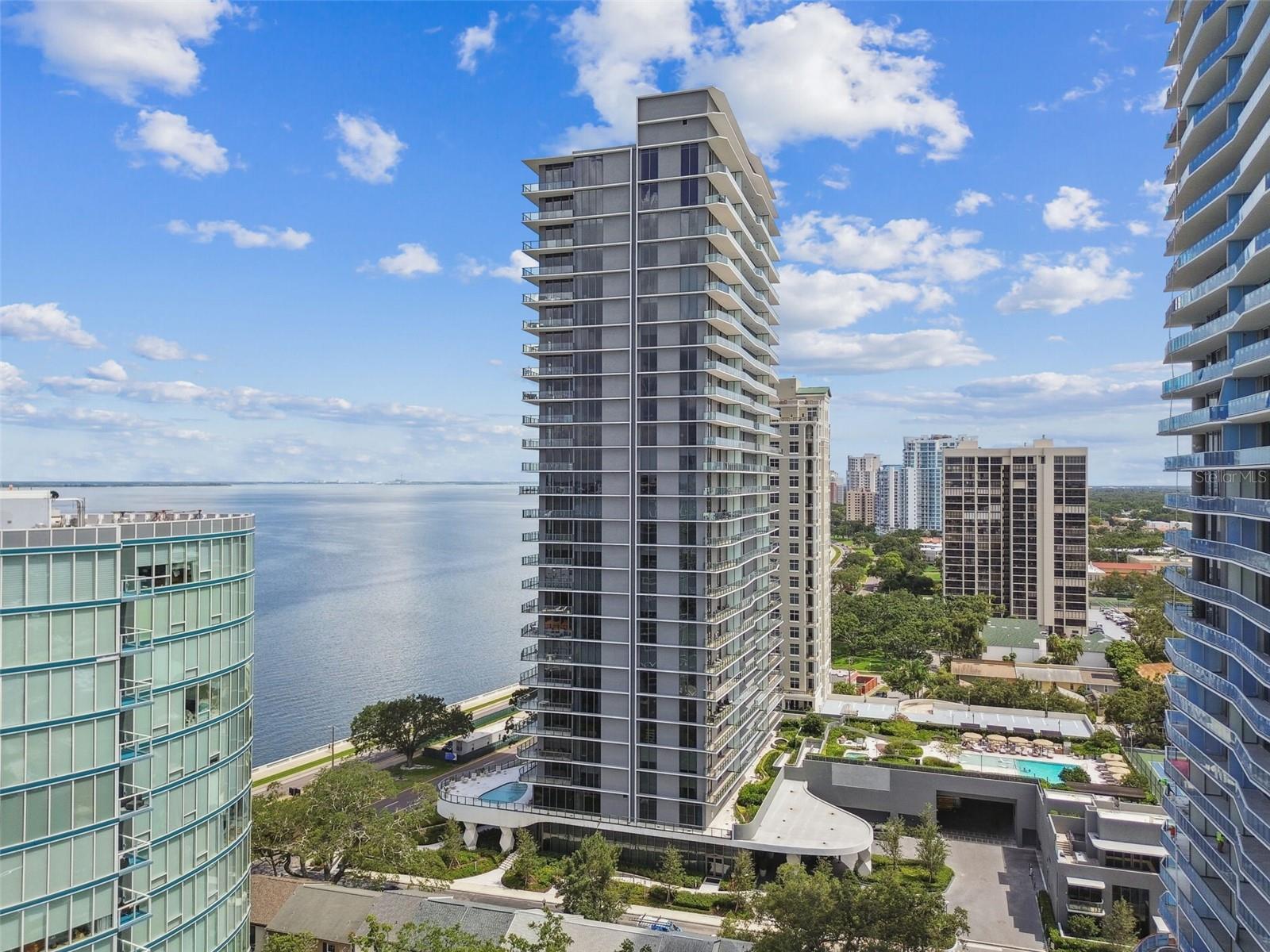 Elevate your lifestyle in this brand-new, designer-furnished residence available for lease at the coveted Ritz-Carlton Residences Tampa. Perfectly positioned on Bayshore Boulevard, one of the most iconic waterfront addresses in Florida, this home captures unobstructed views of Tampa Bay and the glittering city skyline from a massive private balcony—an extraordinary outdoor retreat for elegant entertaining or tranquil sunsets.
From the balcony, you’re looking at miles of scenic waterfront along Bayshore Boulevard, perfect for morning jogs, cycling, or evening strolls. You’re minutes from Hyde Park Village, Downtown Tampa, Amalie Arena, the Straz Center for the Performing Arts, and world-class dining. Sports fans will love the easy access to Raymond James Stadium, home of the Tampa Bay Buccaneers, and Steinbrenner Field for spring training baseball.
Inside, an open-concept great room is framed by floor-to-ceiling glass, while the chef’s kitchen boasts top-tier appliances, quartz countertops, and sleek custom cabinetry. The primary suite is a private retreat with a spa-inspired bath and expansive wardrobe space. This move-in ready residence offers the ultimate in convenience and style from day one.
As a resident, you’ll enjoy the legendary Ritz-Carlton service and curated amenities, including complimentary valet, 24-hour concierge, a resort-style pool, state-of-the-art fitness center, golf simulator, and tennis courts—all designed to anticipate your needs and exceed your expectations.
This luxury rental is available for immediate occupancy to those seeking a rare blend of Tampa Bay energy, and unparalleled service.