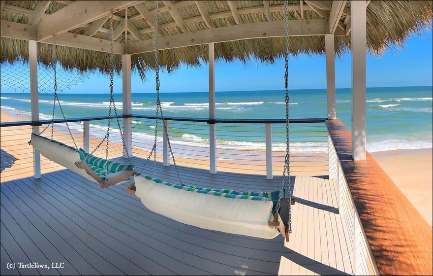 Turn key oceanfront home, total remodel June 2017. Plumbing cabinet with shut-off valves to every water source in house. Circuit panel on every floor for electrical. All plumbing and wiring new in 2017. Nix aerosol spray system outside terminates mosquitos. Spray foam insulation between floors and bedrooms keeps sound to a minimum. All impact glass windows and sliders, and new aluminum roof only 3 years old. Third-floor Master Suite with Direct Ocean View, and Balcony overlooking the water, features Thermasol Steam Shower with Wi-Fi speaker, Aroma Therapy, Rain Shower & Body Jets. Third floor Guest Bedroom with private bath features Direct Ocean View and waterfront Balcony. Top floor Balcony to both Bedrooms is 7’ x 36.’ All Bedrooms pre-wired for Ethernet, and Ocean Sound System. Main floor Living Area has Kitchen, Dining, Living Room, and Office Nook, all with Ocean Views, & steps onto huge Oceanfront 21’x36’ Deck with separate, covered Tiki Porch over the water, with Shower, Propane Gas Grill, and Furniture Storage. Back Decks pre-wired for music & lighting. Deck Railing Cables 316 Stainless Steel, Cumaru or Brazilian Teak hand railings. Large Gourmet, Stainless Kitchen features two Ovens, one with French doors, a Range vented outdoors, Ice Maker, Wine Chiller, full-sized Refrigerator & Freezer, and Franke Custom Food Prep Sink, plus 2nd Disposal. Center Island with Barstools overlooks Main Living Area with expansive Ocean View. Living Room Pre-Wired Surround Sound. Office Niche, with Guest Bathroom. Downstairs are Two Bedrooms, and Single Car Garage & Work-Shop. AC units each floor, Sprinkler System, Alarm System, Hinkley Lighting Fixtures throughout, Solid Interior Doors, Foam Insulation ALL exterior walls and around Mid-Floor Bathroom, Solar Hot Water 120 Gal, Solar Elec. 27 Panels, 500 Gallon Propane Tank for Future Generator & Gas Dryer, and Electrical Wiring for Battery Backup or Generator. No-Drive Beach. ;Water: City