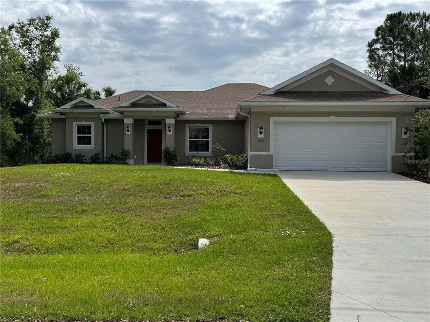 REDUCED PRICE-NEW CONSTRUCTION-MOVE-IN READY!!!!!! Quality home with solid wood soft close cabinets, granite countertops, high ceiling and spacious rooms.  The kitchen has a breakfast bar.  Open concept great room features sliding doors to covered back porch.
A laundry room with cabinets and countertop is located between the kitchen and 2 stall garage.  The split floor plan features a primary bedroom with walk in closet and an ensuite bath with walk in shower, a garden tub , dual sinks and a separate water closet.  The other 3 bedrooms off central hallway with 2nd bathroom also featuring dual sinks and a water closet.  The yard has plenty of room for your future swimming pool should wish to add.  A great home.