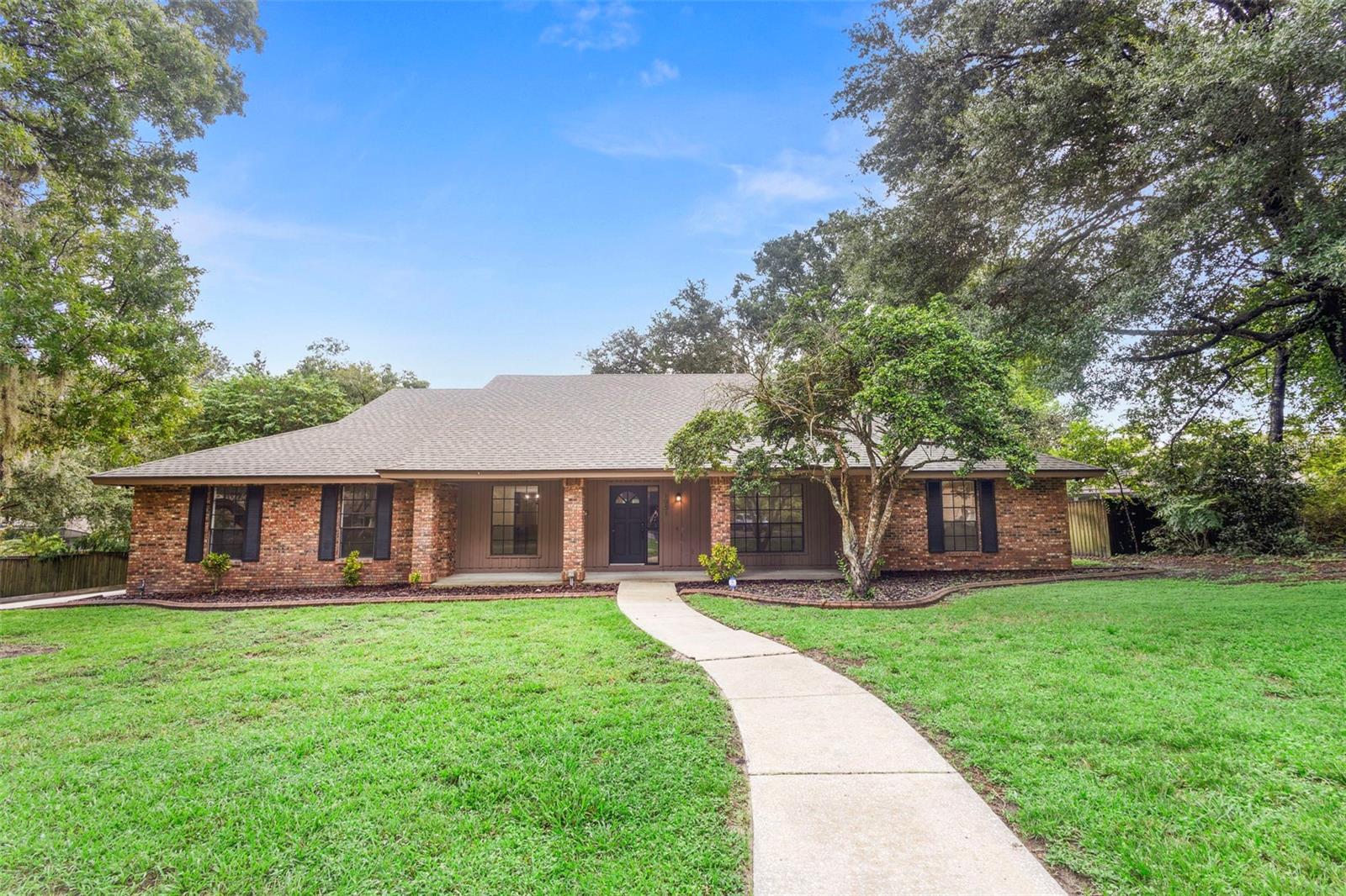 One or more photo(s) has been virtually staged. Set back on a 0.36± acre homesite in Apopka’s established Bent Oak, this single-story pool home brings together solid systems and easygoing indoor-outdoor living. Behind its brick-accent façade, you’ll find 4 bedrooms, 2 baths, and 2,118± sq ft arranged for everyday comfort—tile floors flow through the main living areas, a wood-burning fireplace anchors the gathering space, and wide sliders draw you toward the backyard and pool.
Major updates are already handled where it counts: newer architectural shingle roof and HVAC, and a prior whole-home repipe. The kitchen and baths are neat and functional today, with clear upside for the cosmetic refresh you’ve been envisioning. Out back, an open-air pool sets the stage for weekends in the sun, with a covered porch for grilling and dining and a deep yard under mature trees.
Bent Oak is loved for its winding, sidewalk-lined streets and relaxed vibe, close to everyday essentials yet minutes from some of Central Florida’s best natural escapes. Spend the afternoon at Wekiva Springs State Park or Wekiva Island, tee off at nearby Wekiva Golf Club, or head to shopping and dining along 441/436 and the Altamonte/Hunt Club corridors. Commuters will appreciate convenient access to area employers and major routes.
If you’re looking for a move-in-ready home with meaningful updates already in place—and room to personalize—1951 Lost Pine Lane is a smart find. Bring your ideas, add your style, and enjoy the pool lifestyle and shade-canopy streets that make Bent Oak such a pleasant place to come home to.