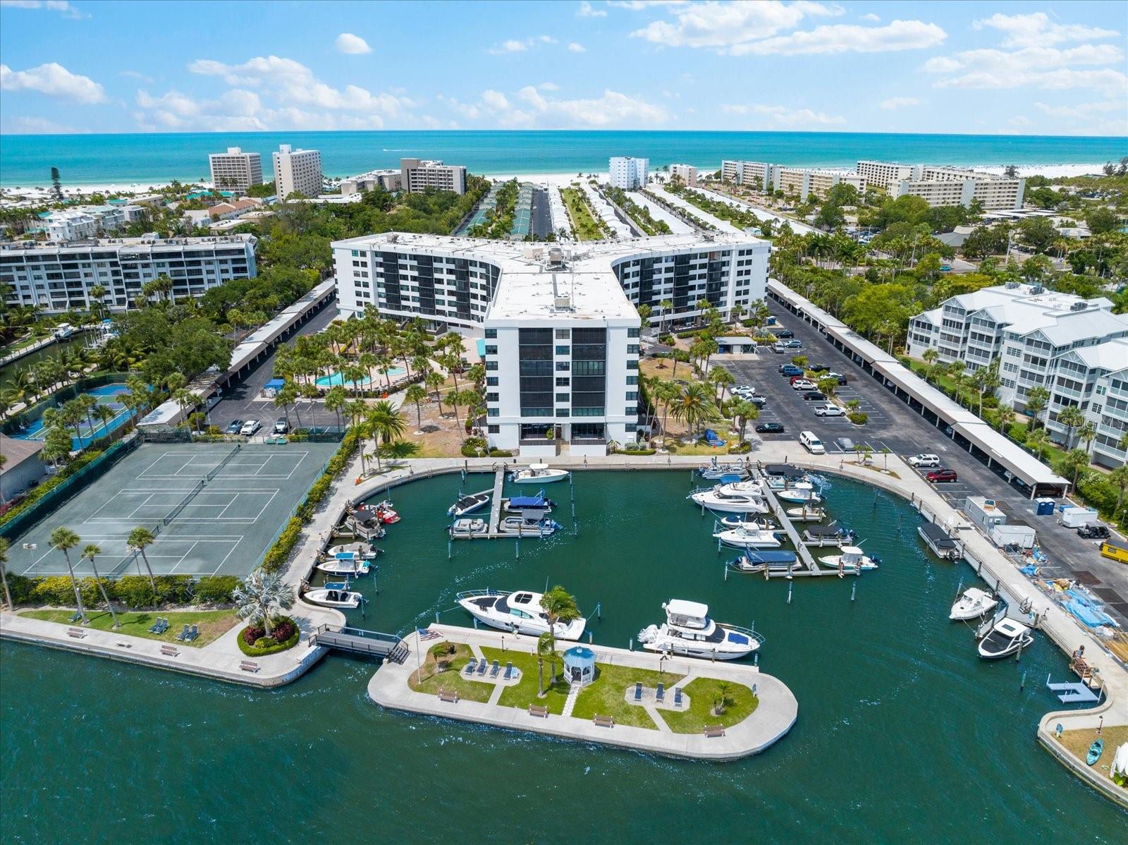 This stunning condo at Harbor Towers Yacht & Racquet Club offers an unparalleled investment opportunity, combining luxurious living with a resort-style ambiance. Thoughtfully updated with meticulous attention to detail, the condo features new luxury vinyl flooring and a beautifully remodeled kitchen, complete with solid wood cabinets and granite countertops, elevating the space to a new level of comfort and sophistication. Set in the heart of tropical Siesta Key, the condo boasts breathtaking water views from one of the widest stretches of intracoastal frontage, making it an exceptional find. The community’s impressive amenities include a state-of-the-art fitness center, two heated pools, and three illuminated Har-Tru tennis courts, catering to both relaxation and recreation. Additional conveniences like high-speed WIFI, gas grills, a boat basin, and the serene Island Gazebo—perfect for unwinding or dolphin watching—enhance the waterfront lifestyle. Ideally situated, the property is just moments from Siesta Key Village, offering an array of boutique shopping and dining options. Residents also enjoy complimentary access to the Siesta Key Open Air Trolley, making it easy to explore the island. With Siesta Key’s world-famous beaches just minutes away and Sarasota’s vibrant cultural and entertainment scene within a short drive, the location truly offers the best of both worlds. Whether you’re seeking a full-time residence, a vacation retreat, or an exceptional investment property, this condo promises an enviable lifestyle in one of the world’s most desirable beach destinations. Don’t miss your chance to call this extraordinary property home!