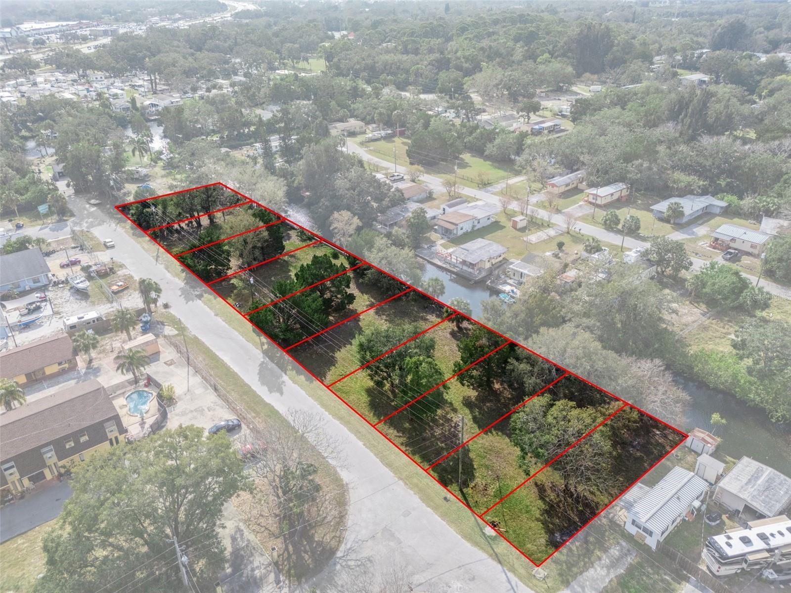 1 of 10 lots available. See Main Listing TB8396142. Owner is willing to sell individual lots on the canal as well. This is 1 lot listing. There are a total of 10. Buy one or buy all. Owner will not split up lots in the middle. Must buy the end lots first if not wanting all of them. ---------The following information is from the Main listing. Call for more information R-4 Zoned 6-10 buildable lots. NEW PRICING $330k for 10 lots or $330k takes all 10. Will sell individually as well at $33k per lot but will not split out of middle. Oceanfront Living with Gulf Access – Build Your Dream Waterfront Oasis. Imagine waking up to the serene beauty of a canal of crystal-clear freshwater spring fed right in your backyard, offering year-round cool temperatures (72–74 °F) perfect for swimming, snorkeling, and spearfishing. This rare gem of a property combines the tranquility of nature with unbeatable convenience. Enjoy pristine, barnacle-free waters—no oyster cuts or boat damage here—and a front-row seat to incredible manatee activity as they drink from the spring and keep warm in winter. With direct Gulf access, easy reach to Florida’s top fishing spots, sandbars, and attractions like SunWest Park, Tarpon Springs, and Clearwater, this is your chance to build the ultimate waterfront escape. No HOA, affordable costs, and full freedom to design your ideal home—this isn’t just land; it’s the gateway to your dream lifestyle. Don’t wait—secure your piece of paradise today!